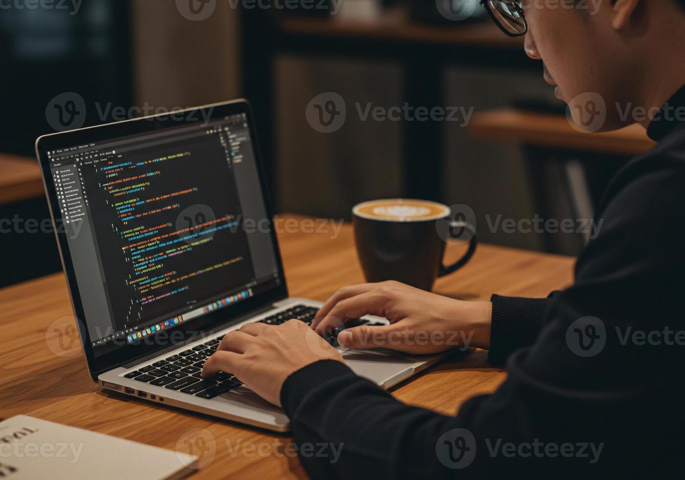 1400x980 Programmer coding on a laptop at a cafe with a cup of coffee