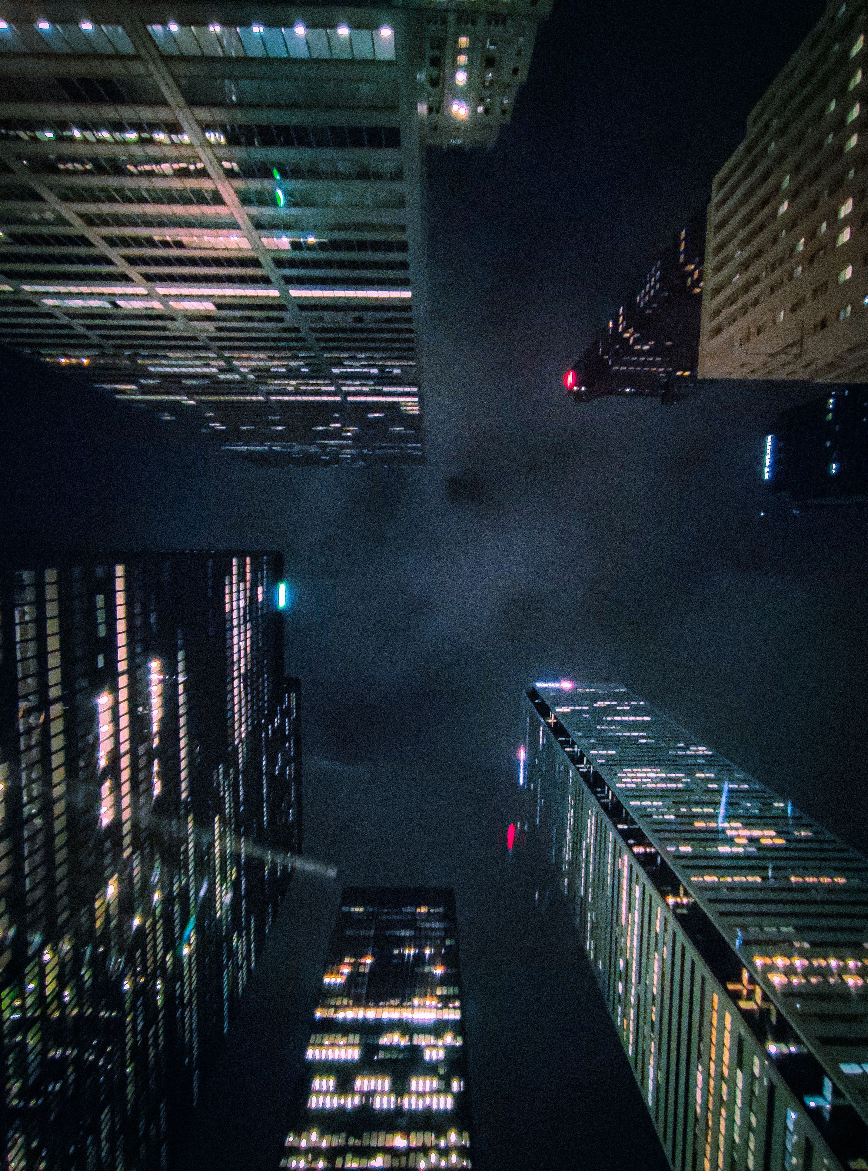 2865x3862 Dark City 4k Wallpaper Dark City Skyline Next To A Lake 4K Phone Wallpaper