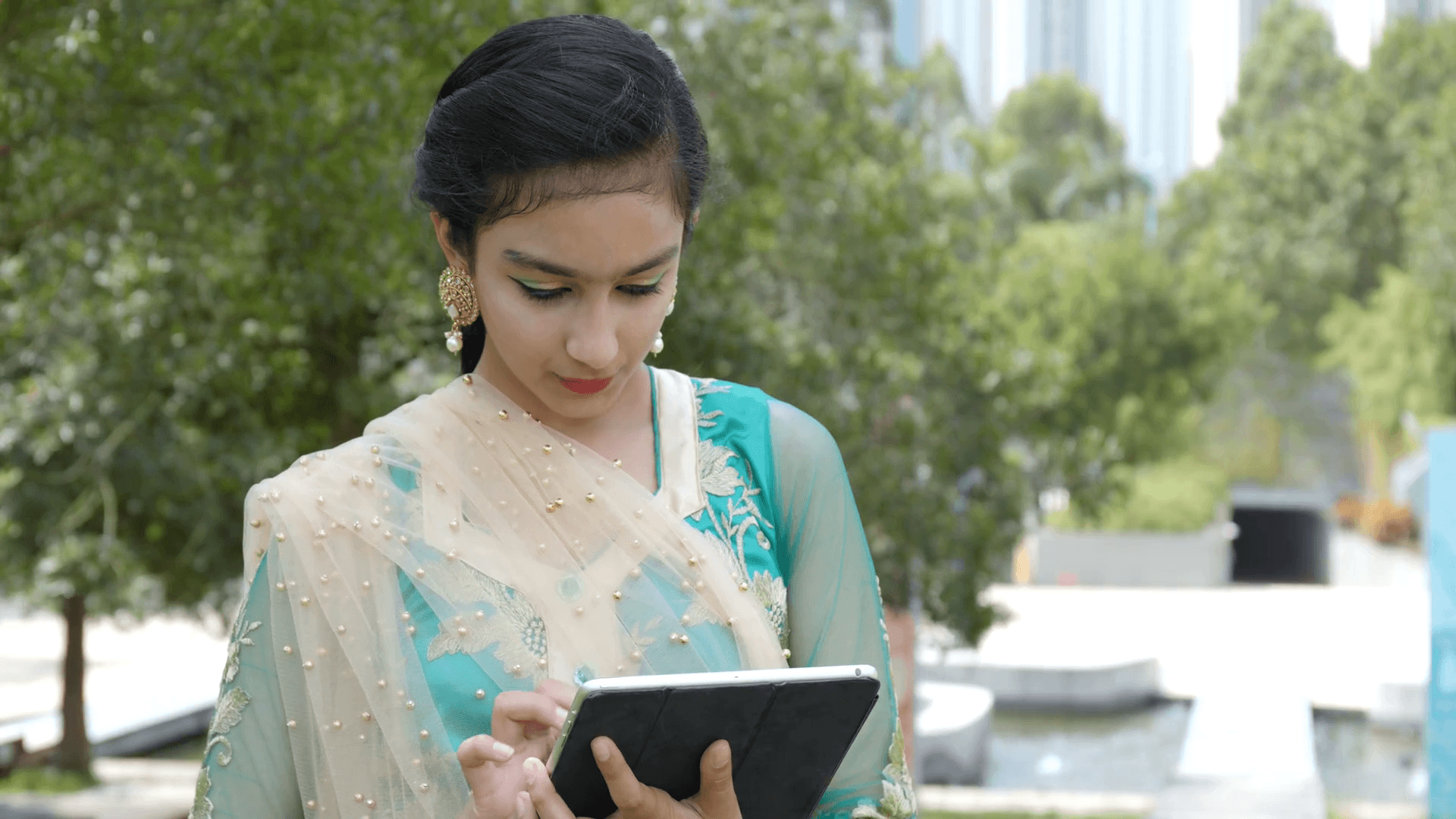 1920x1080 Young Pakistani Girl Using Tablet In The Park Stock Girl Image Full HD Wallpaper & Background Download