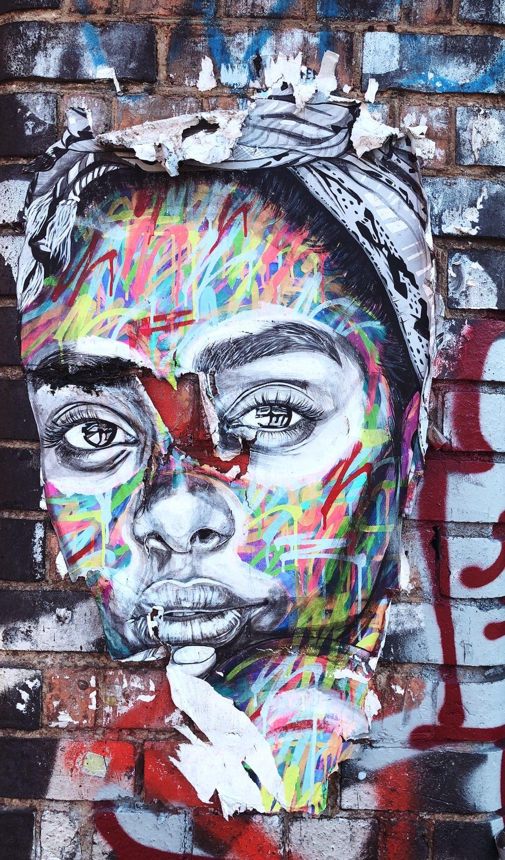 1000x1702 graffiti of woman's face on wall photo