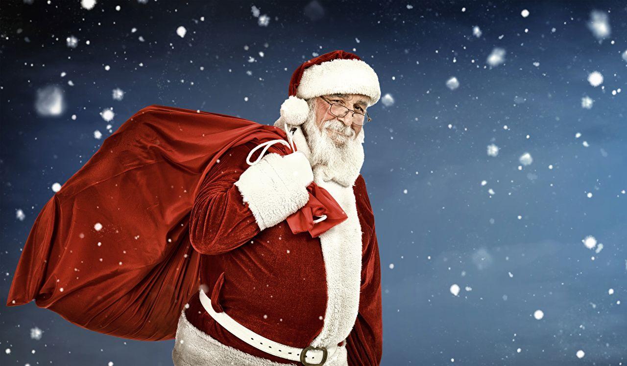 1280x749 Desktop Wallpaper New year Smile Snowflakes Winter hat Santa Claus