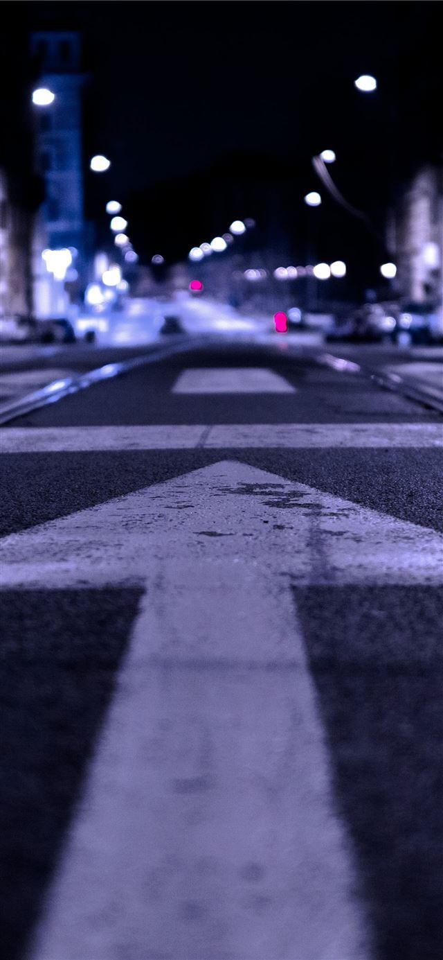640x1385 shallow focus photography of road with forward arr. iPhone 12 Wallpaper Free Download