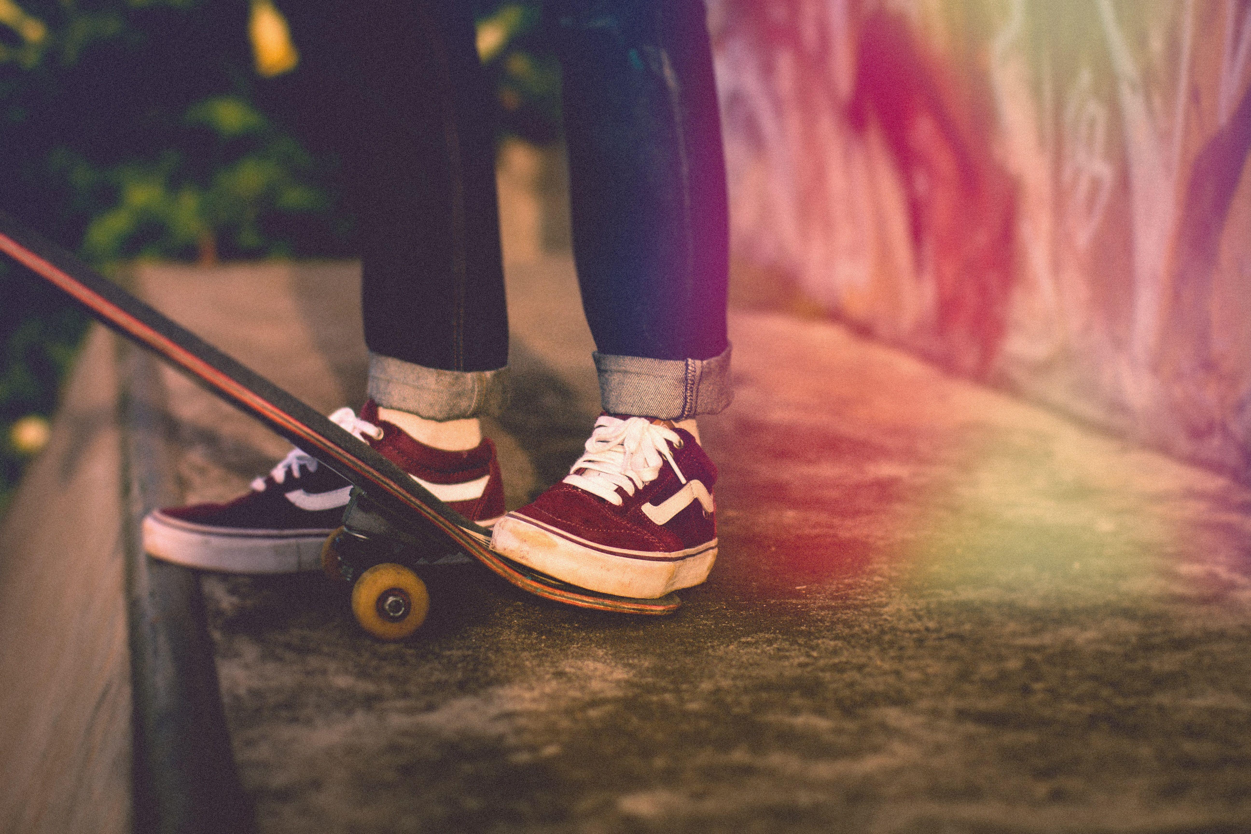 5184x3456 Person On Black Denim Jeans And Vans Sk8 Low Stepping Vans Wallpaper & Background Download