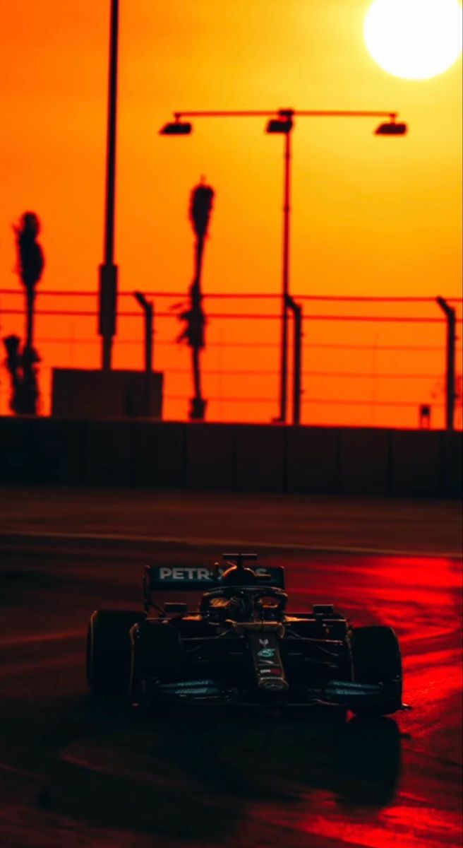 656x1200 Formula 1 Car Racing at Sunset. Racing car in sunset, F1 sunset wallpaper, Subtle f1 wallpaper