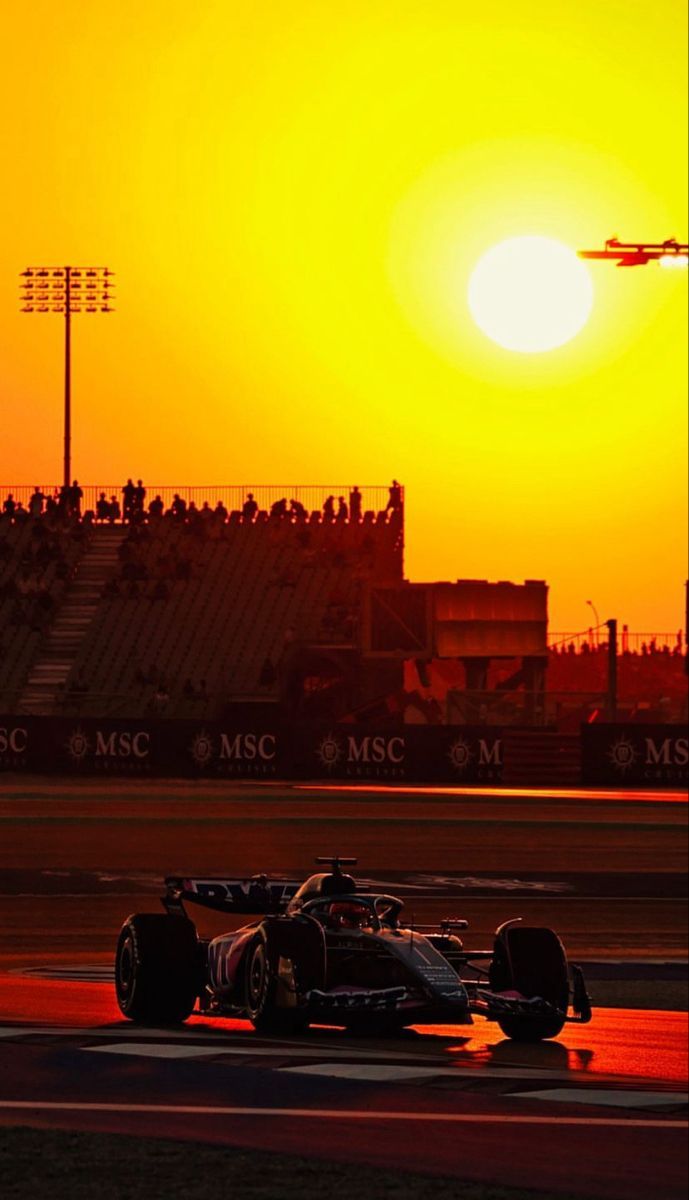 689x1200 Evening racing event ideas. F1 car racing at sunset, F1 track evening light, Wallpaper charles leclerc