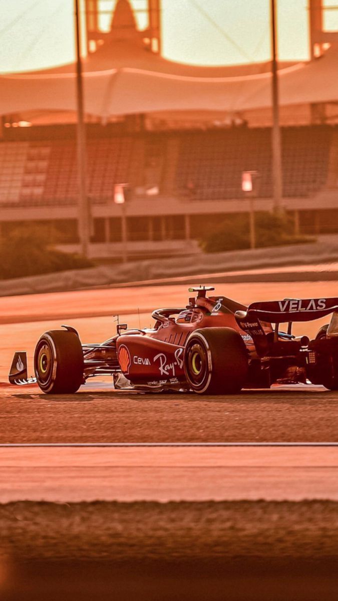 675x1200 Red Race Car on the Track. Ferrari f1 screensaver, Red racing car sunset, Ferrari f1 1986 wallpaper