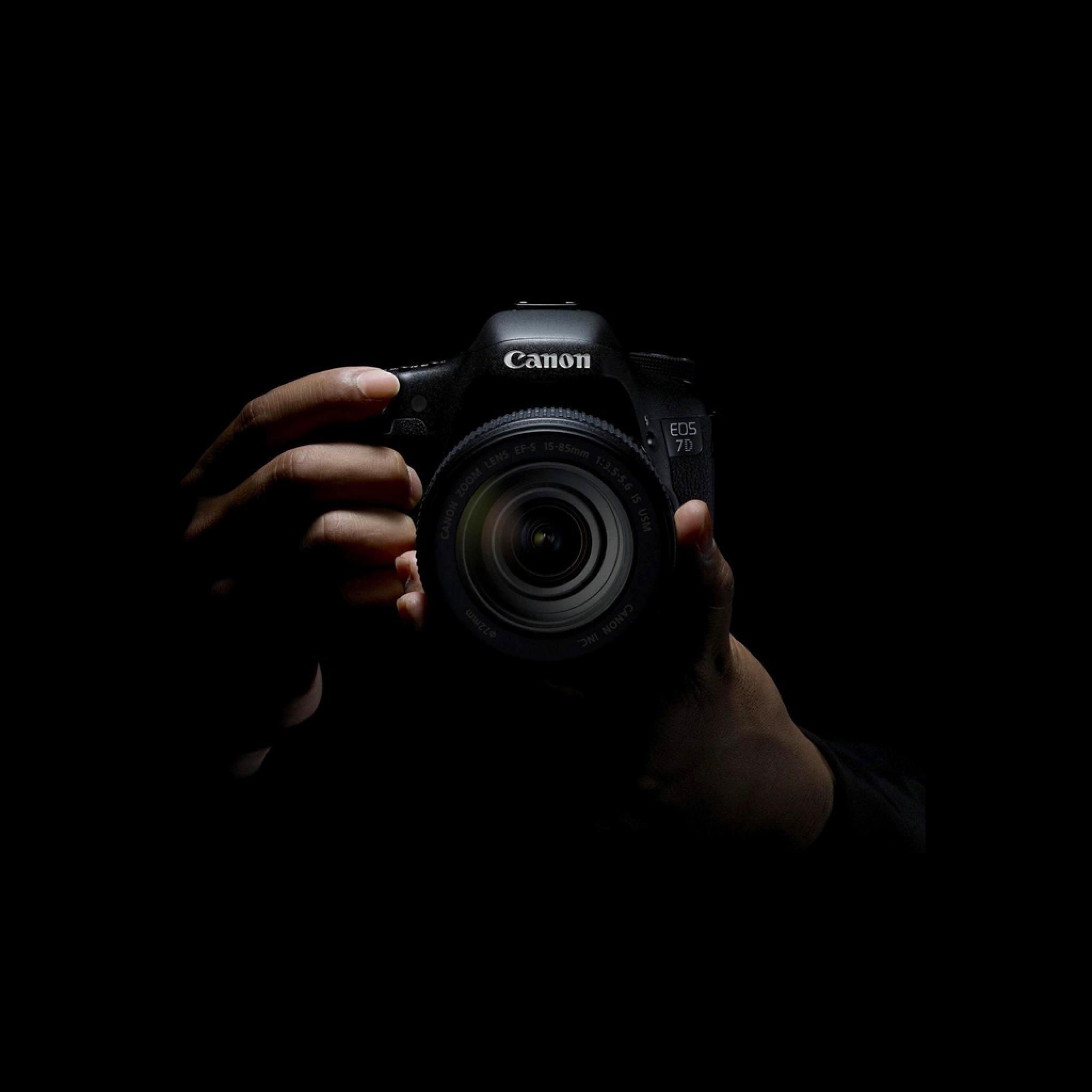 black photographer with camera