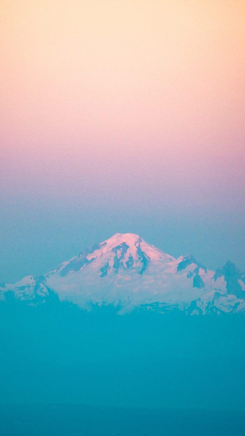 950x1689 Mountain Peak Sunset Orange Blue Mist 4K Ultra HD Mobile Wallpaper