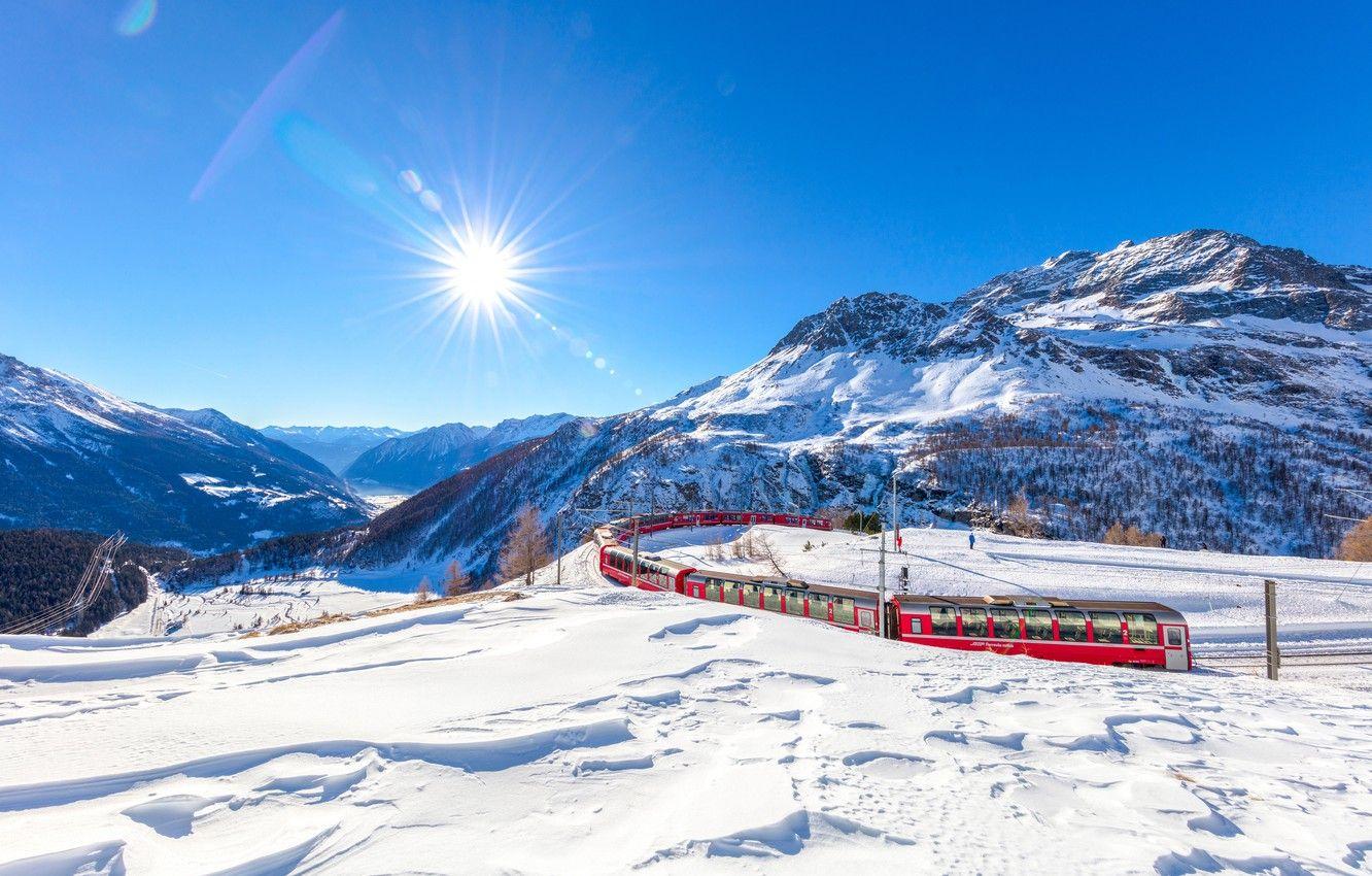 1332x850 Wallpaper winter, the sky, the sun, rays, snow, trees, mountains, train, Switzerland, valley, Alps, railroad, Graubunden image for desktop, section пейзажи
