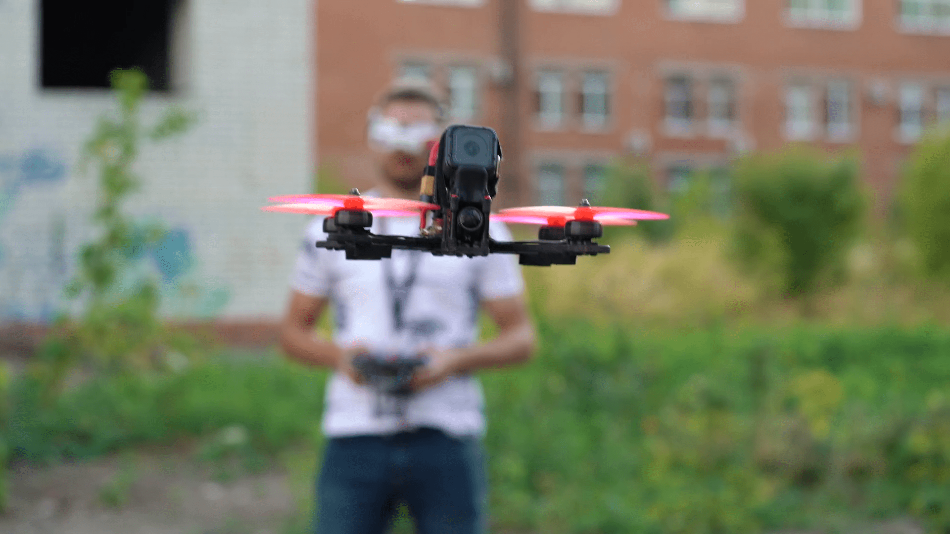 1920x1080 Male pilot controls FPV freestyle drone in flight Stock Video Footage