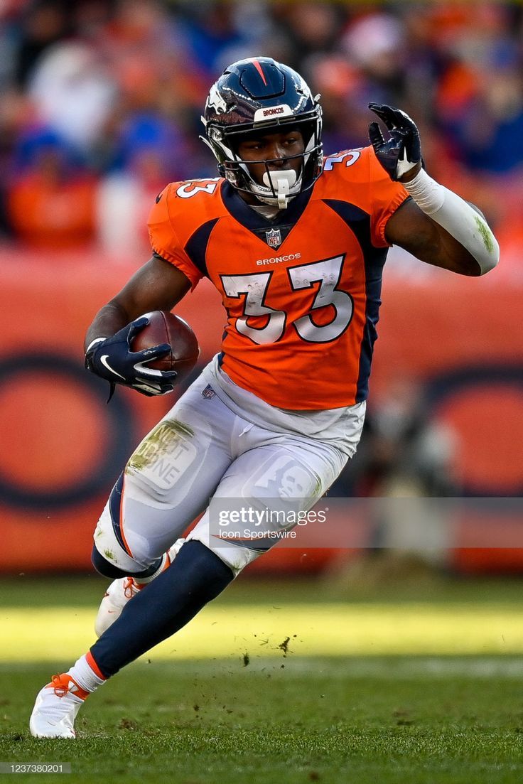 736x1103 Denver Broncos running back Javonte Williams carries the ball during. Javonte williams broncos, Broncos vs bengals, Patrick surtain ii broncos