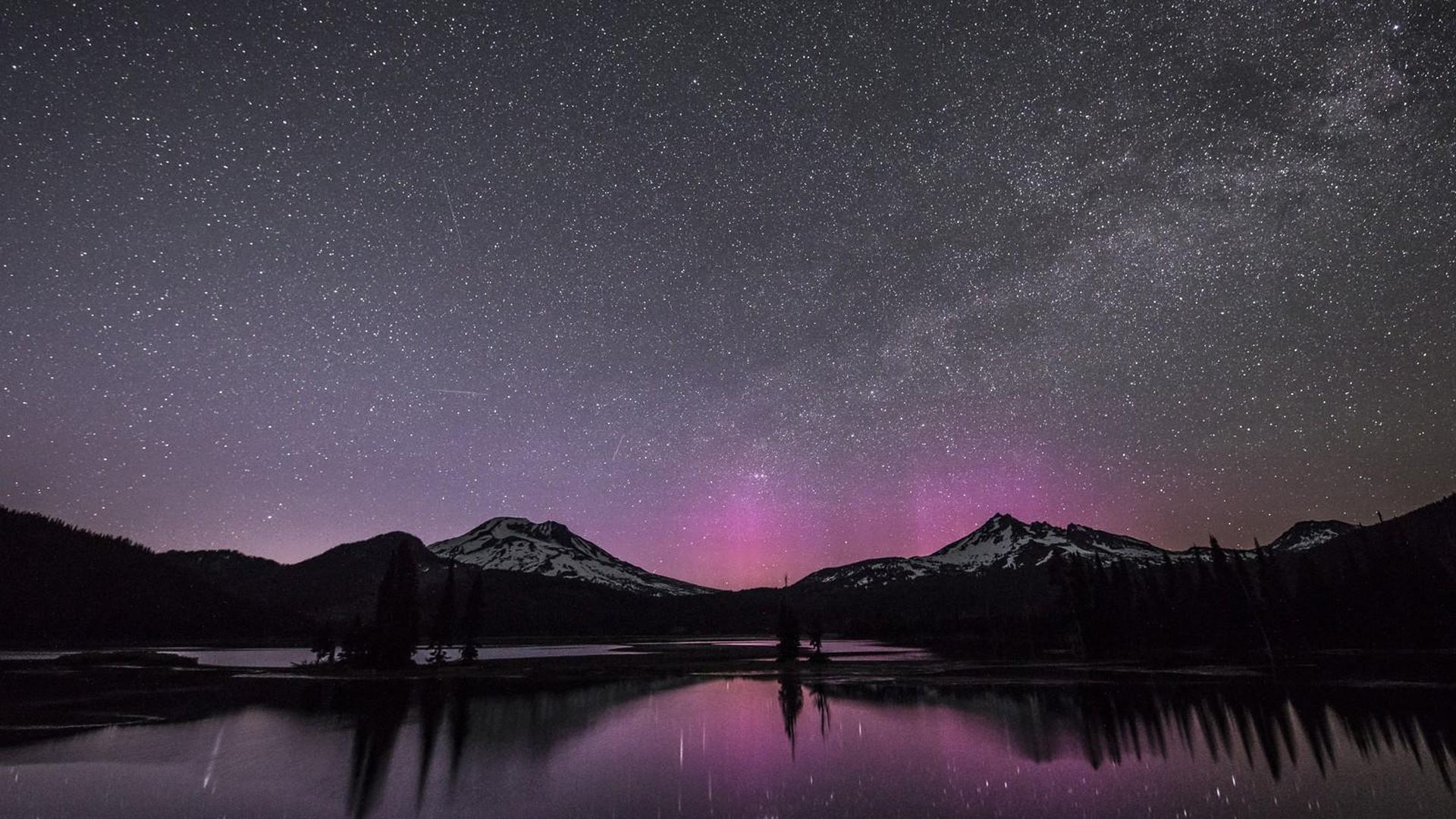 1920x1080 Snow Covered Mountain Near Lake Under Dark Sky With Stars HD Space Wallpaper