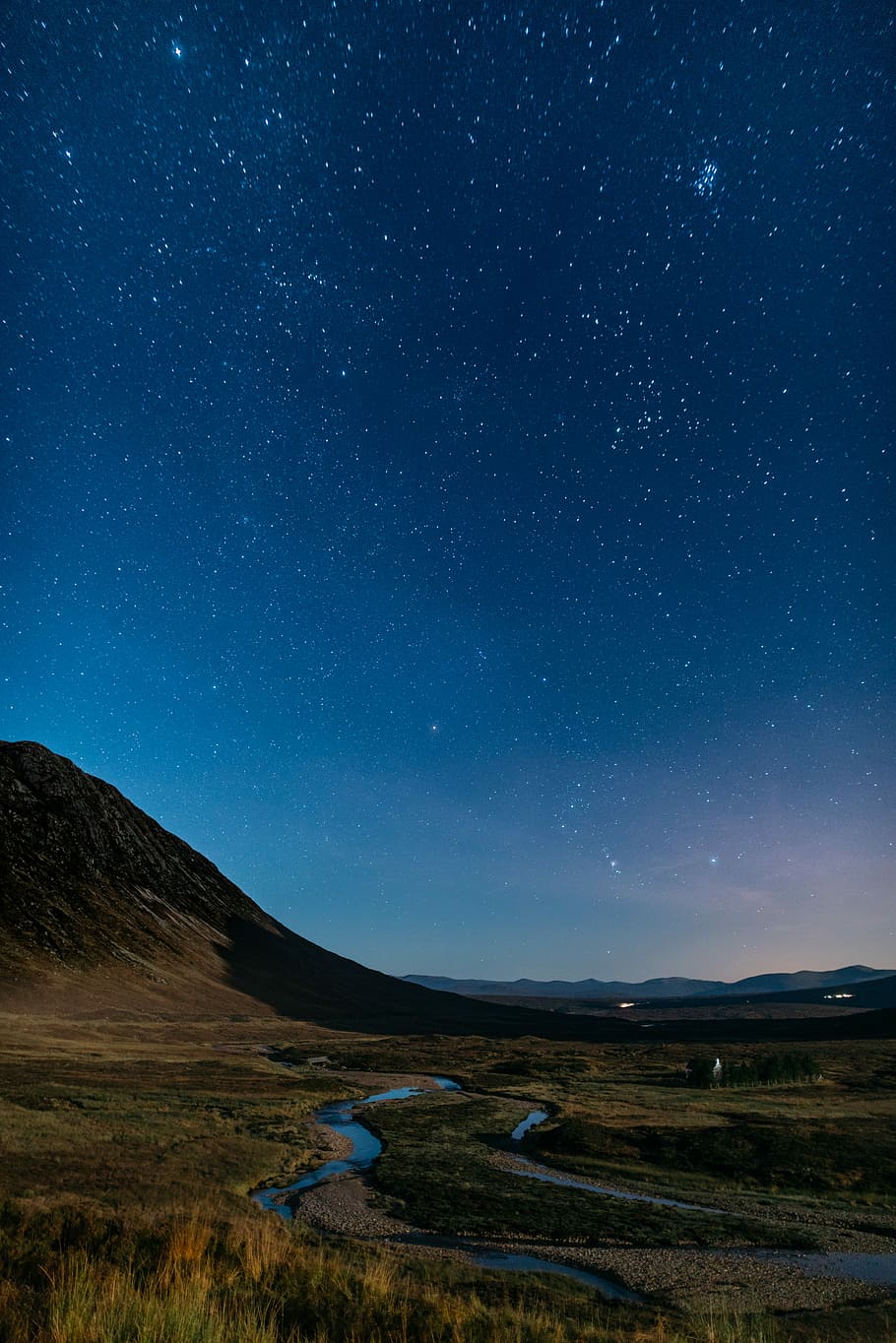 910x1364 HD wallpaper: starry sky above mountain, river near mountain at night, dark