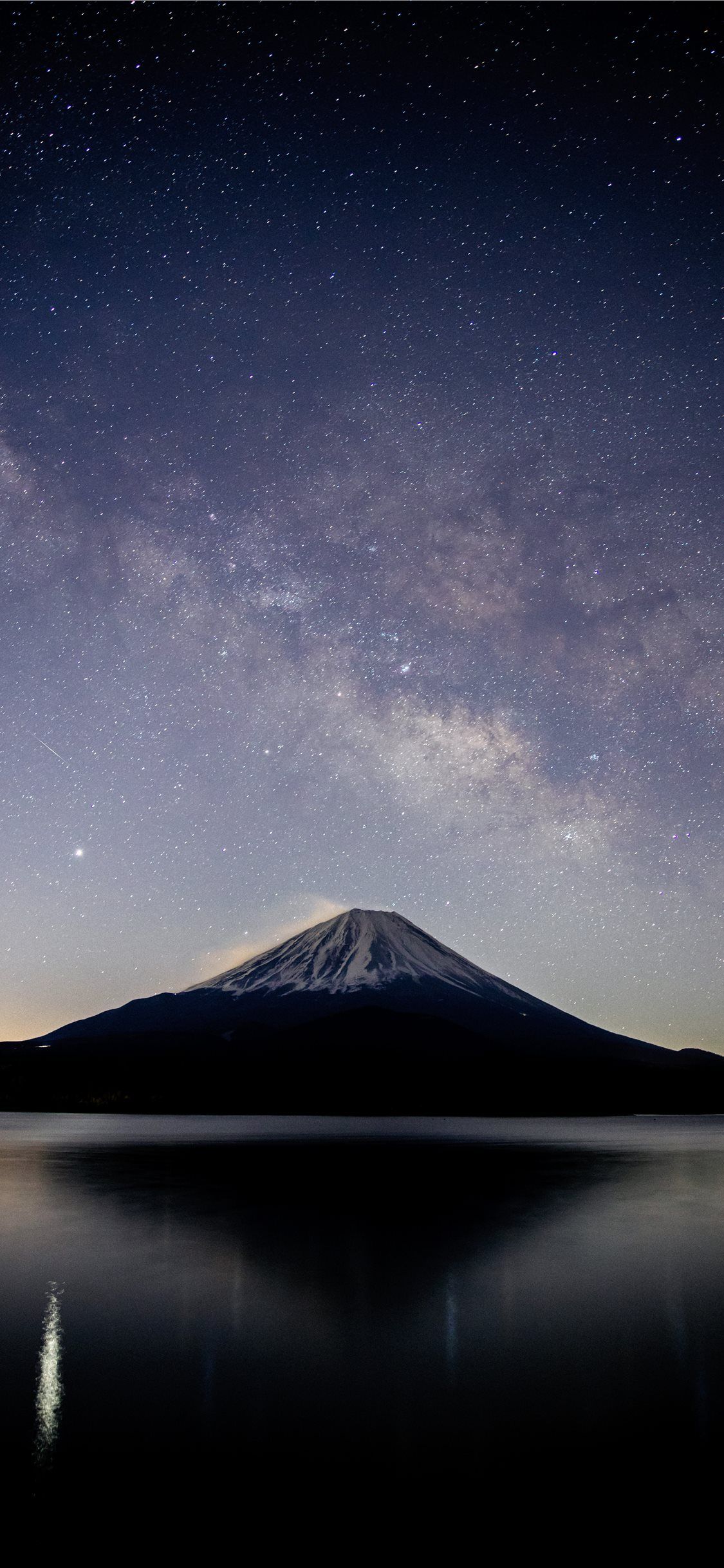 1125x2436 snow covered mountain near lake under starry night iPhone X Wallpaper Free Download