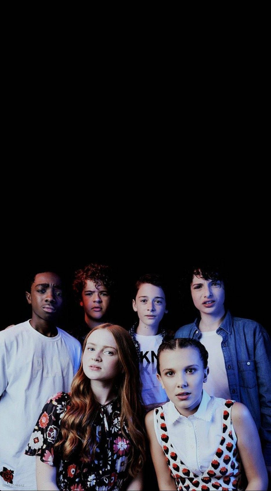 936x1691 Download These the kids from Stranger Things brave yet lovable misfits who stand up to the supernatural forces of the Upside Down Wallpaper