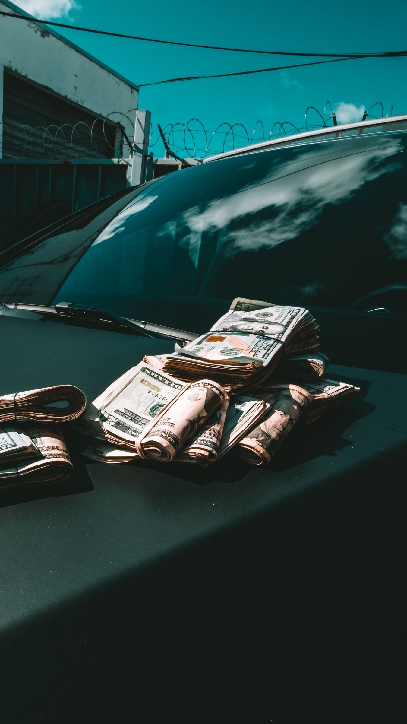 1350x2400 Download wallpaper 1350x2400 dollars, money, bills, car, hood iphone 8+/7+/6s+/for parallax HD background