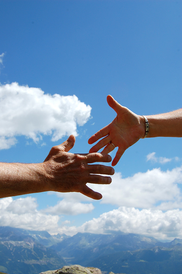 728x1095 Royalty Free Photo: Two Hands Reaching Each Other