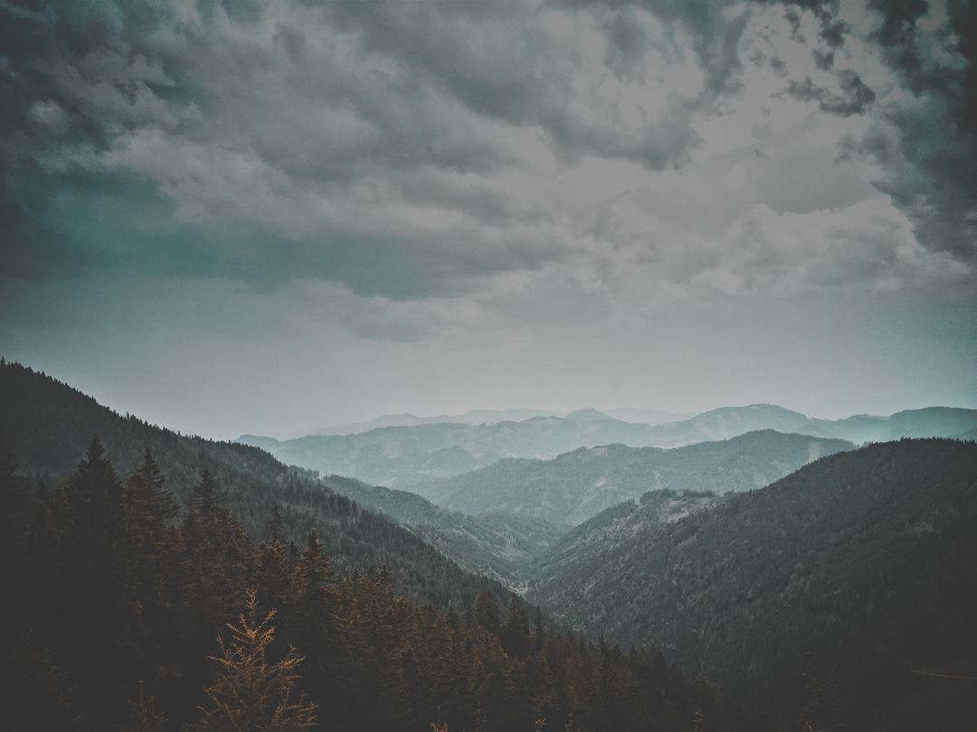 1080x810 Dark Moody Landscape of Mountain Range and Forest Stock Image