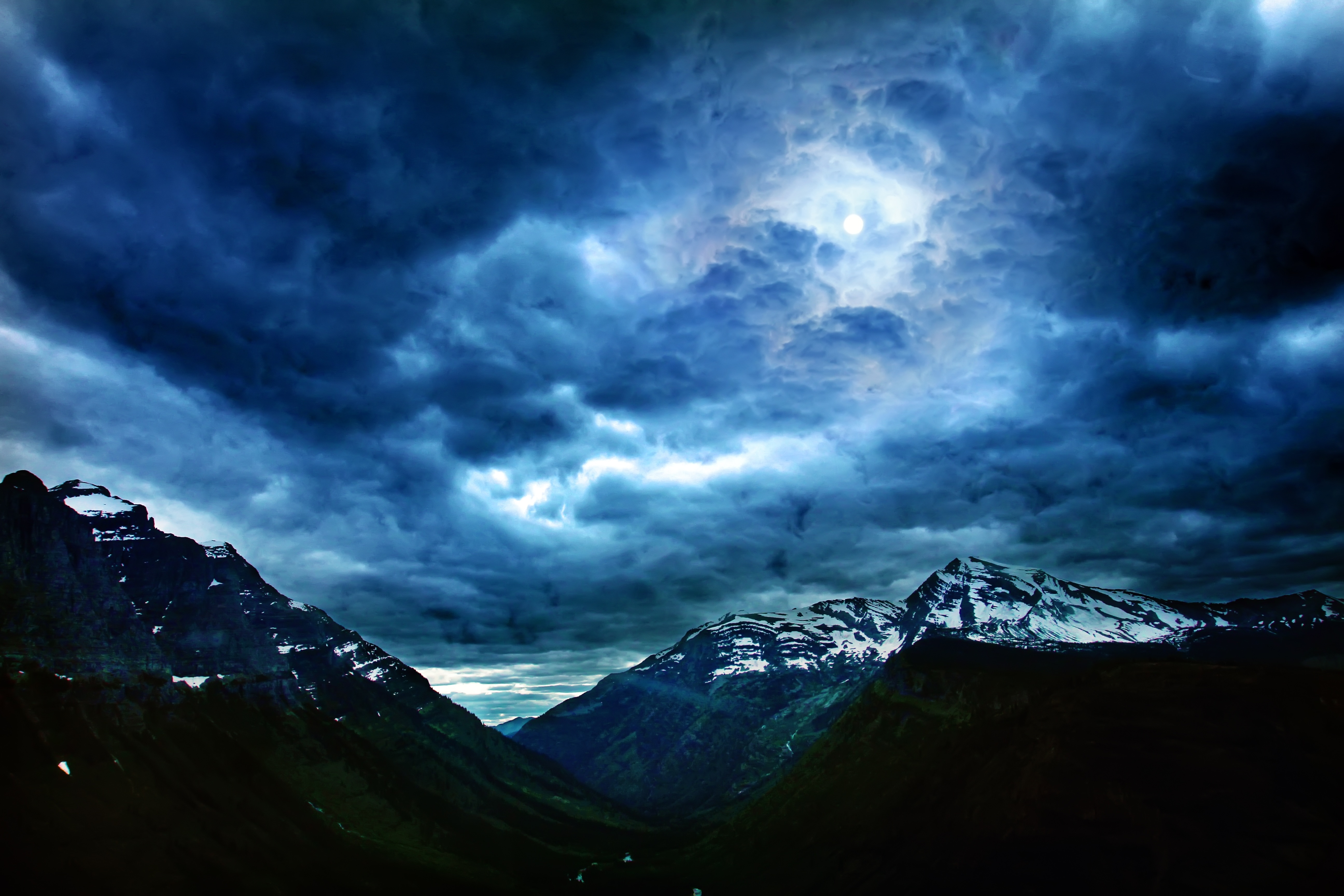 5184x3456 wallpaper. glacier mountain under dark clouds
