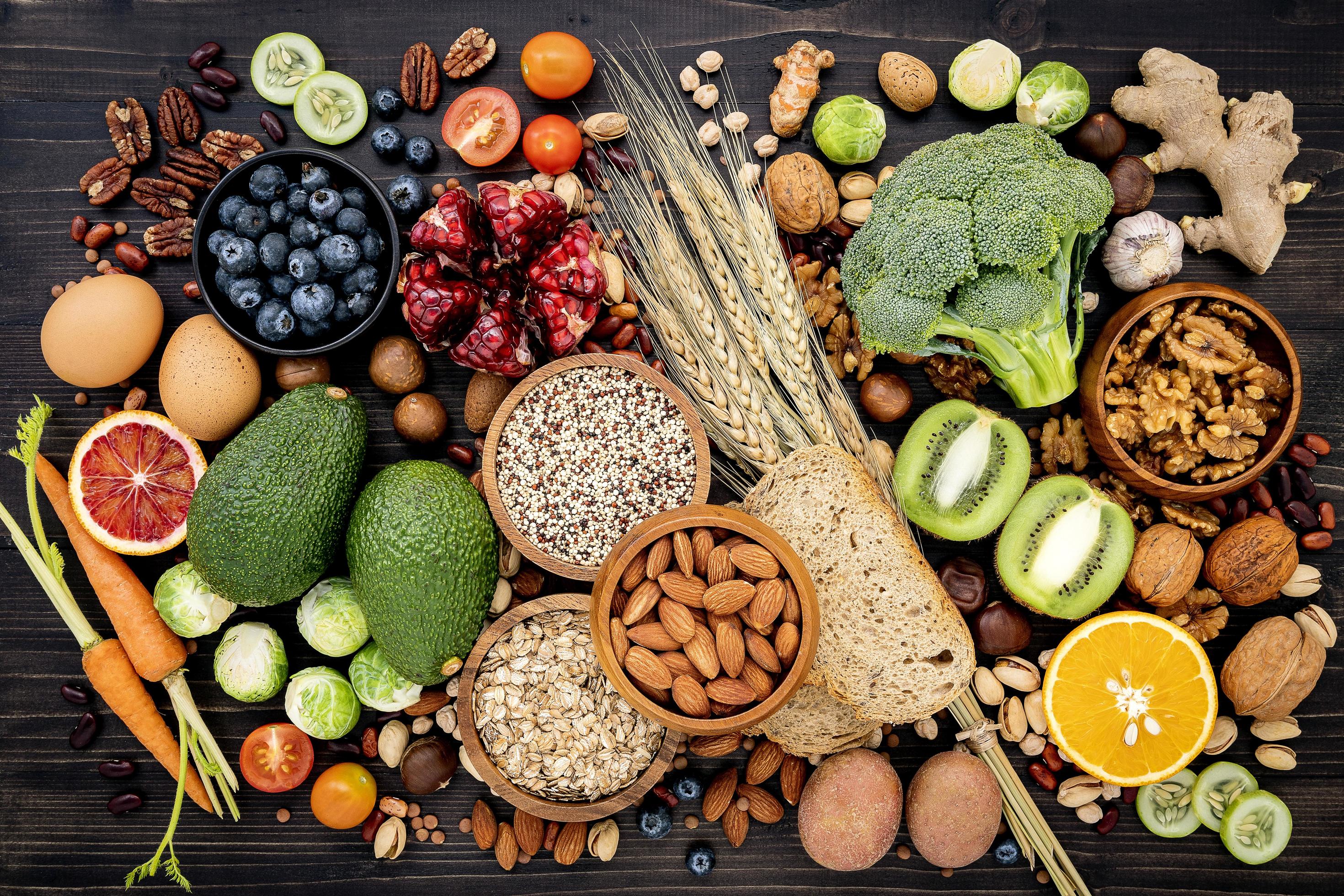 2940x1960 Top view of healthy foods on a black background