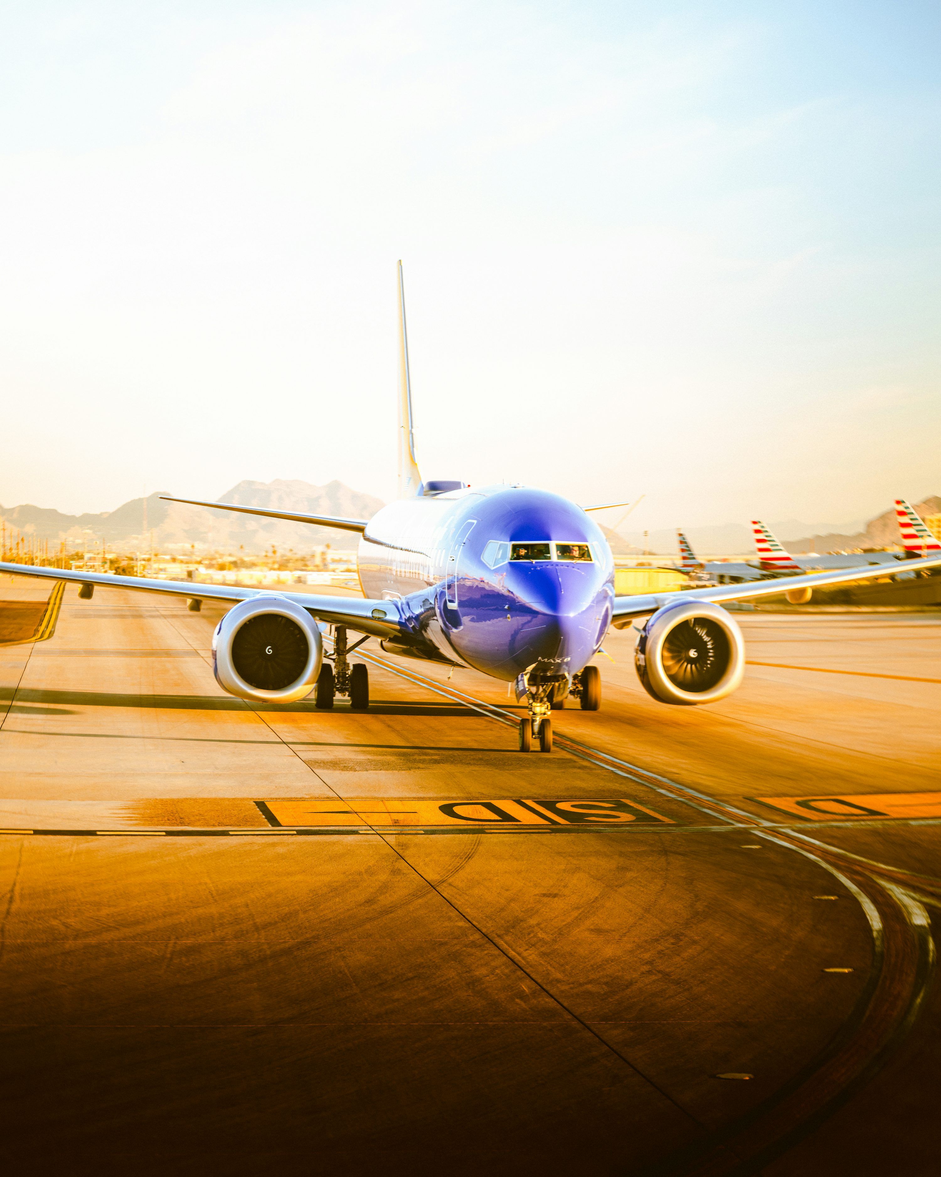 3000x3750 A large jetliner sitting on top of an airport tarmac