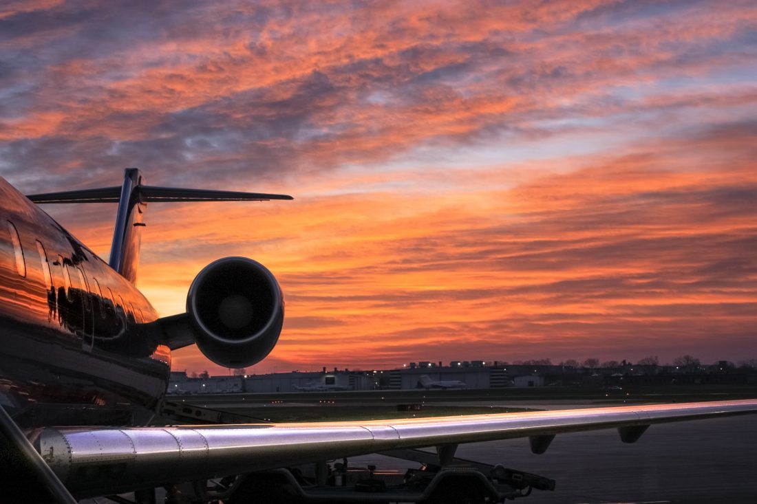 1100x733 Airplane At Sunset Royalty Free