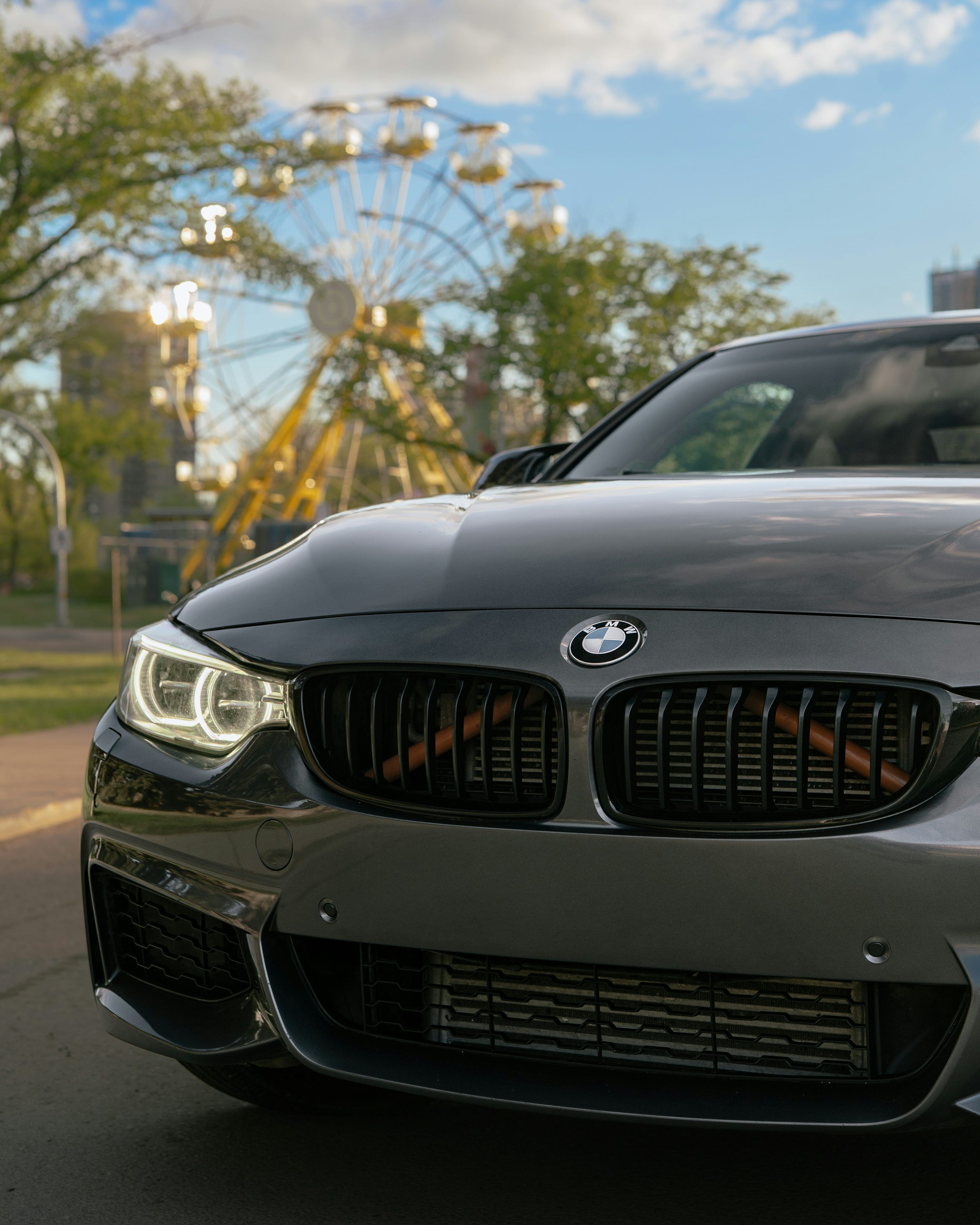 3000x3750 Gray BMW car with ferris wheel in background