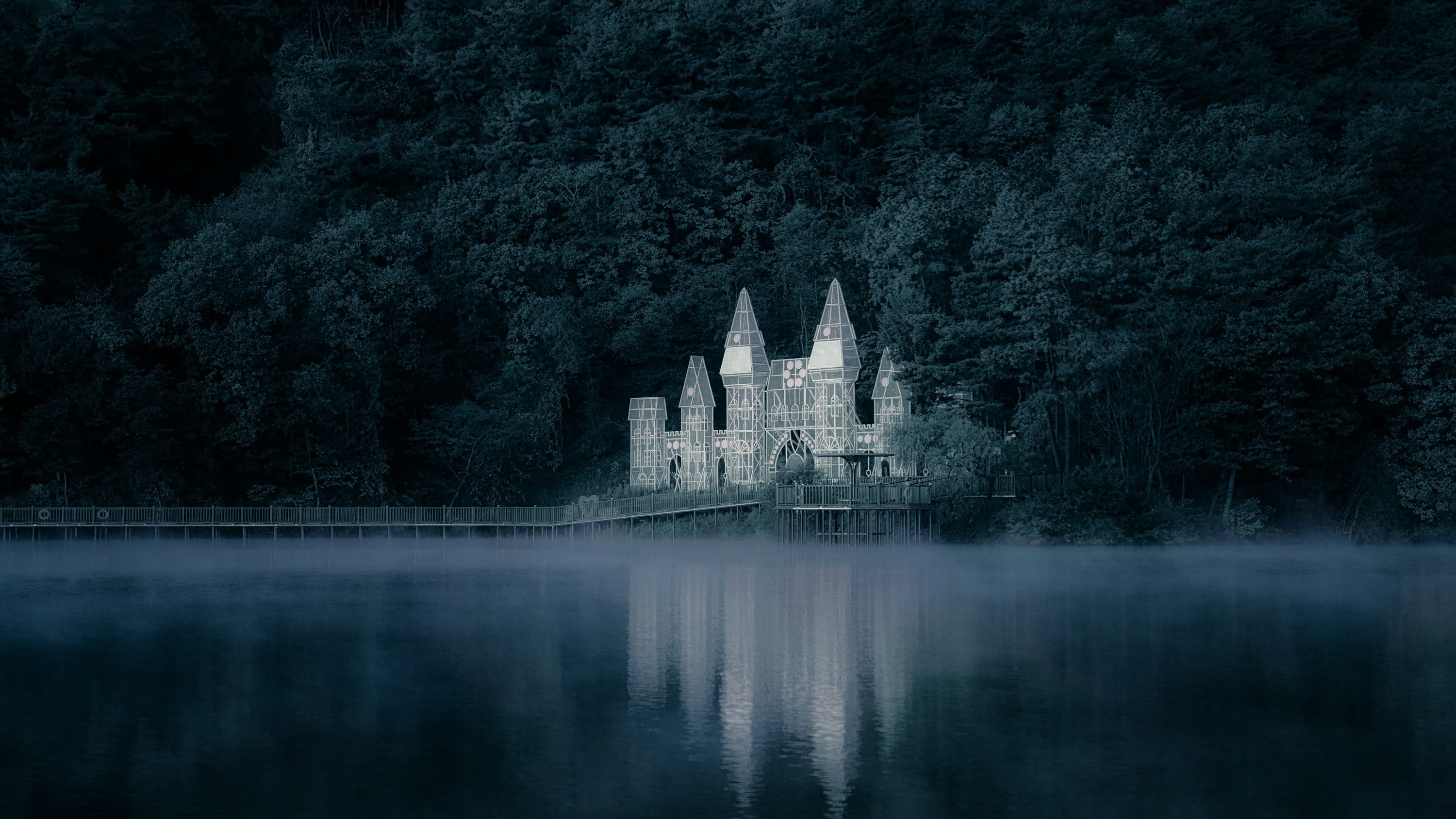 3000x1688 A castle in the middle of a lake at night