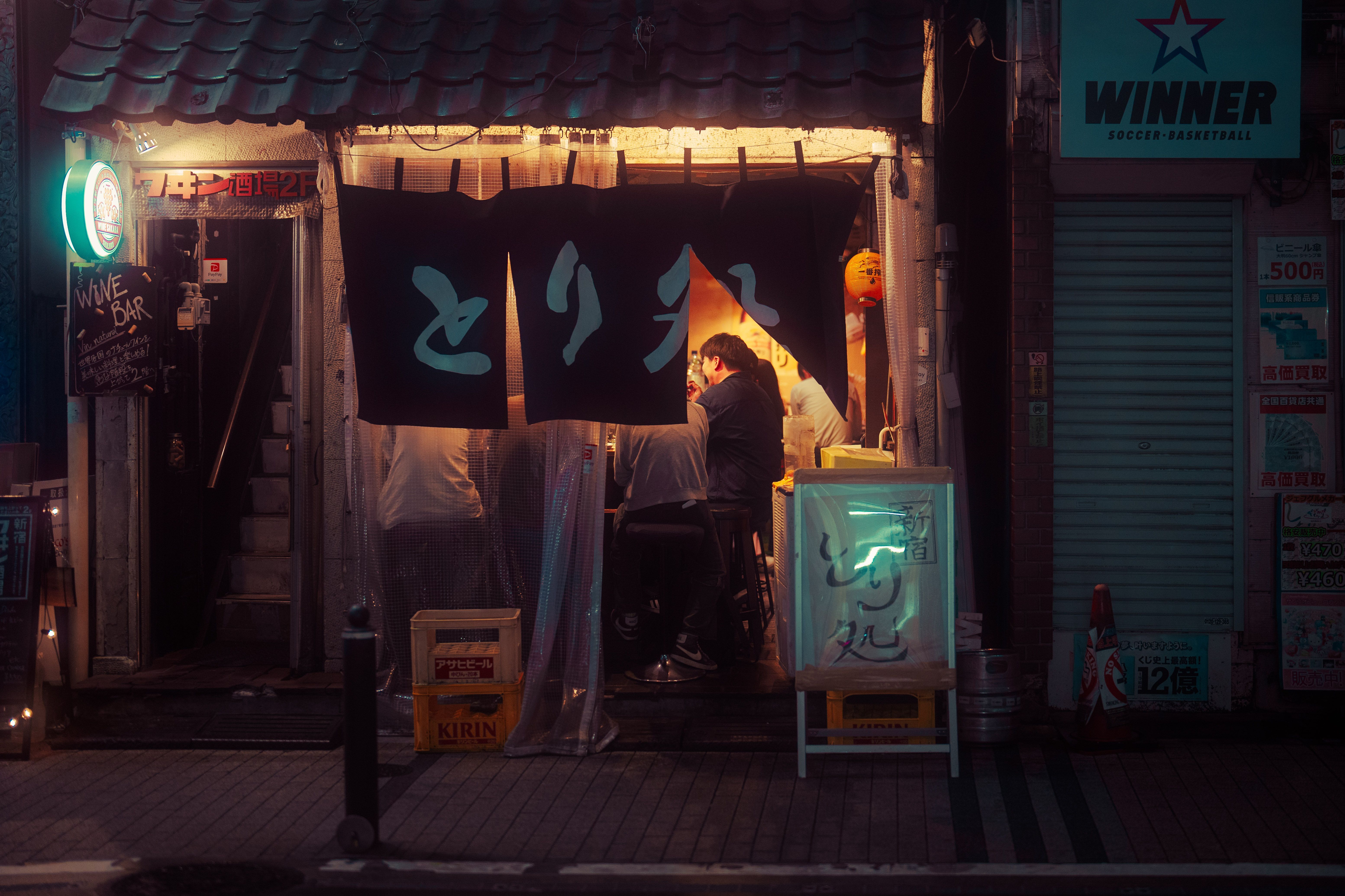6213x4142 Japanese Shop Window with Neon Sign and Sake Bottles · Free