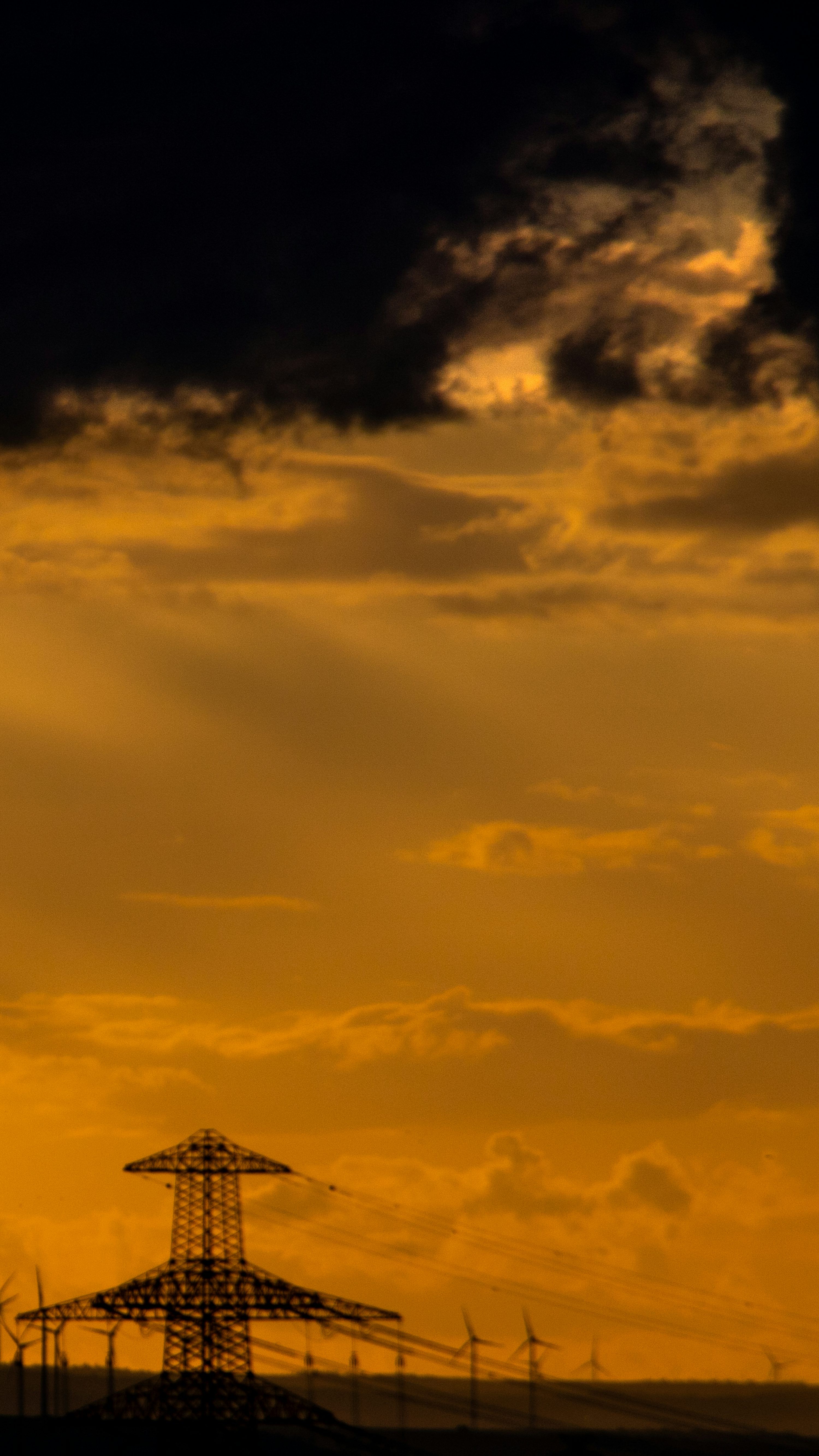 3000x5333 Electricity pylon silhouette in orange sky
