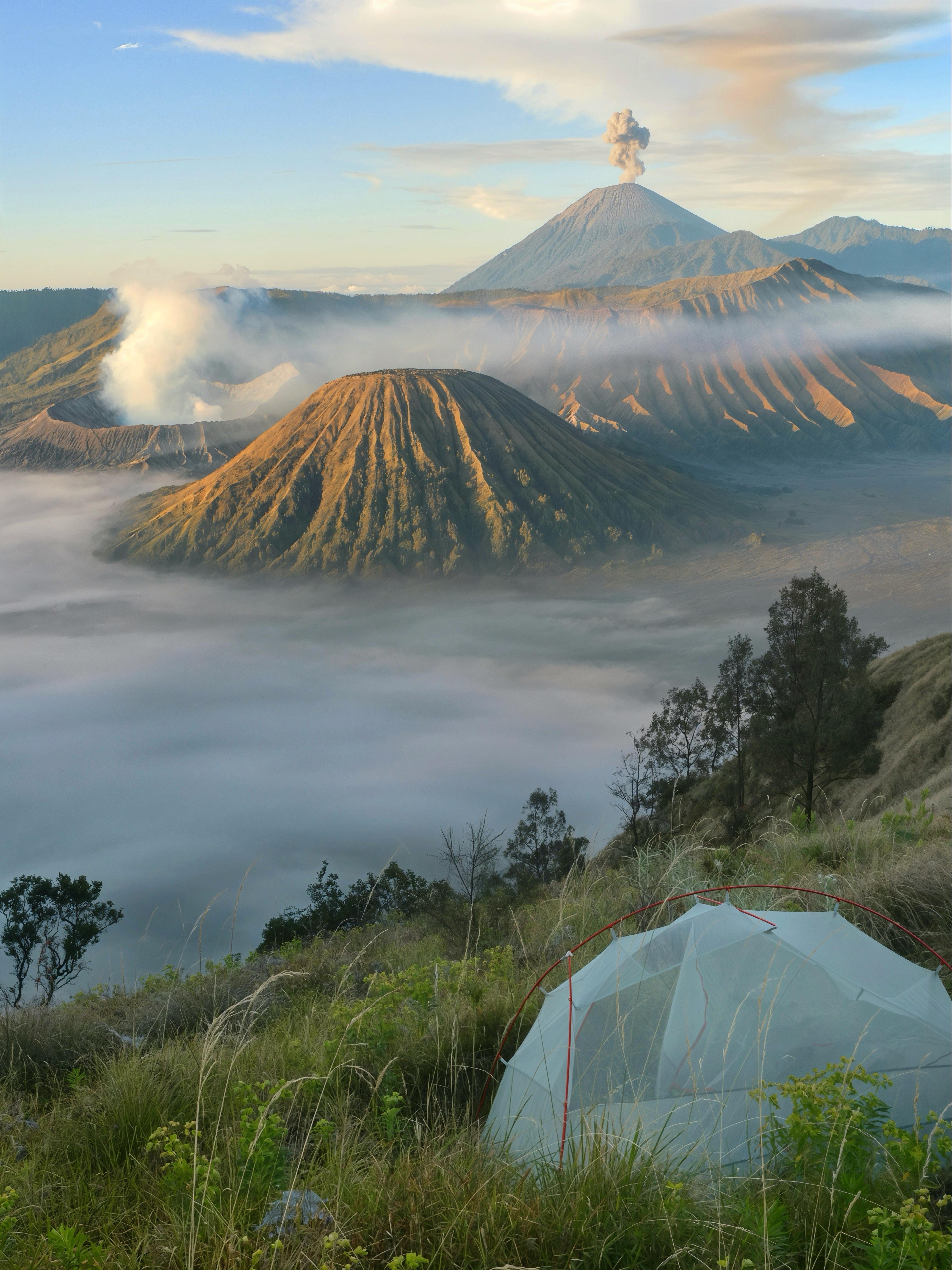 3464x4618 Don't think I'll ever get a better spot than that! Mt Bromo and Mt Semeru erupting at the same time, golden sunrise lighting, and a cloud inversion in the caldera [Java, Indonesia]