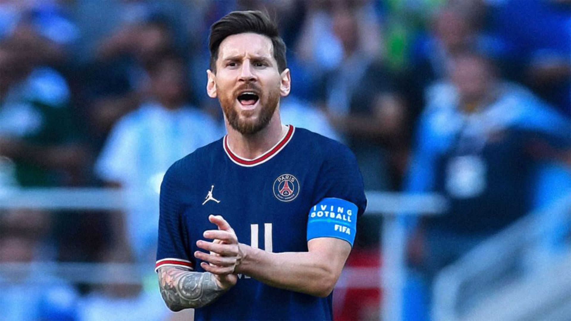 1920x1080 Messi PSG Is Wearing Blue Sports Dress Standing In Blur Audience Background HD Messi Wallpaper