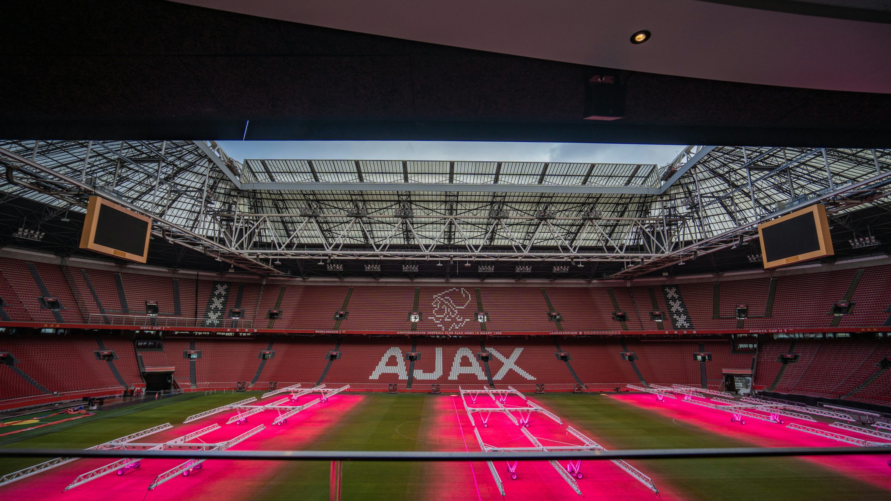 3000x1688 The inside of a stadium with the ajax logo on it
