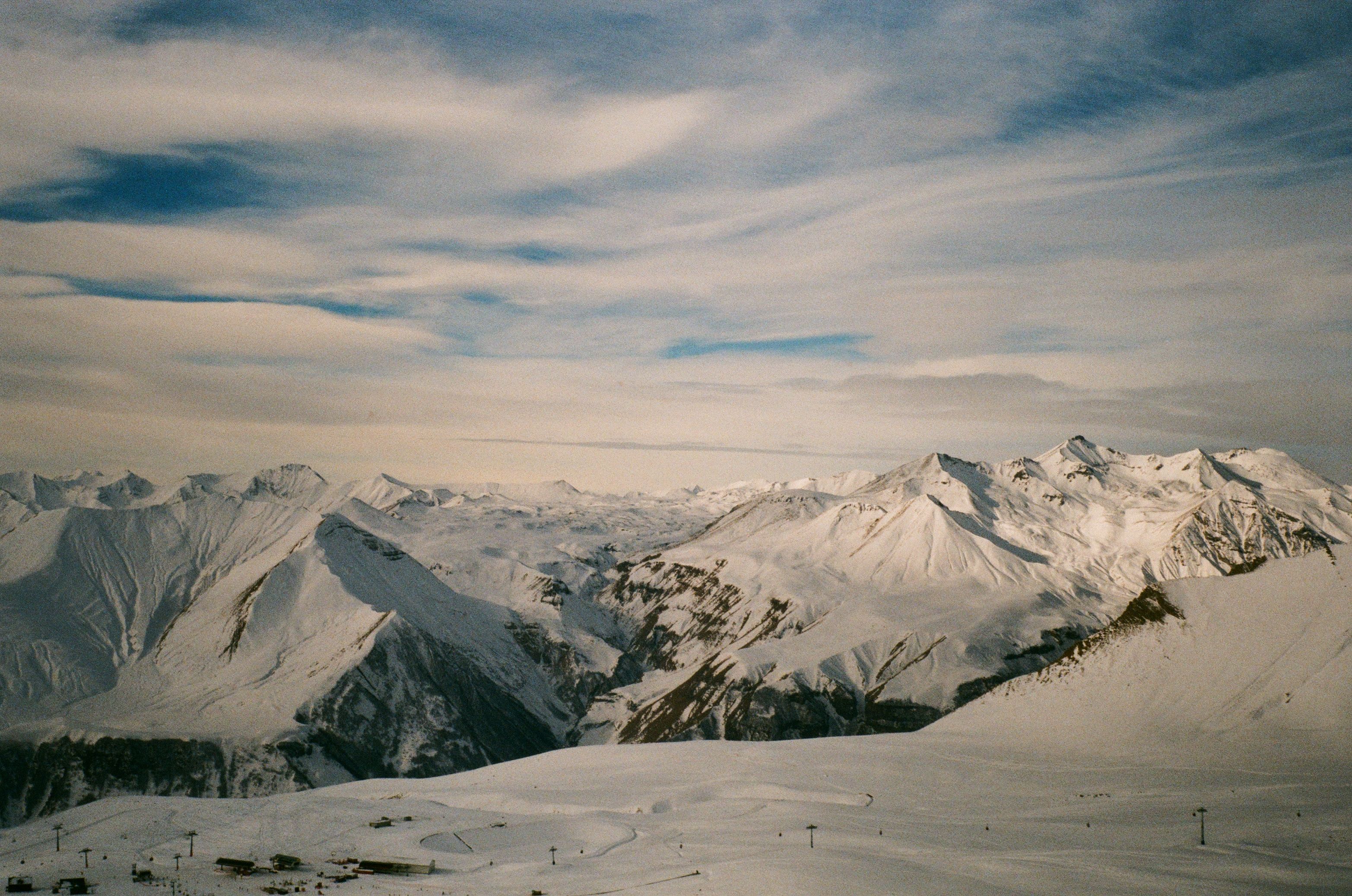 3130x2075 Snow Covered Mountains Under Cloudy Sky · Free