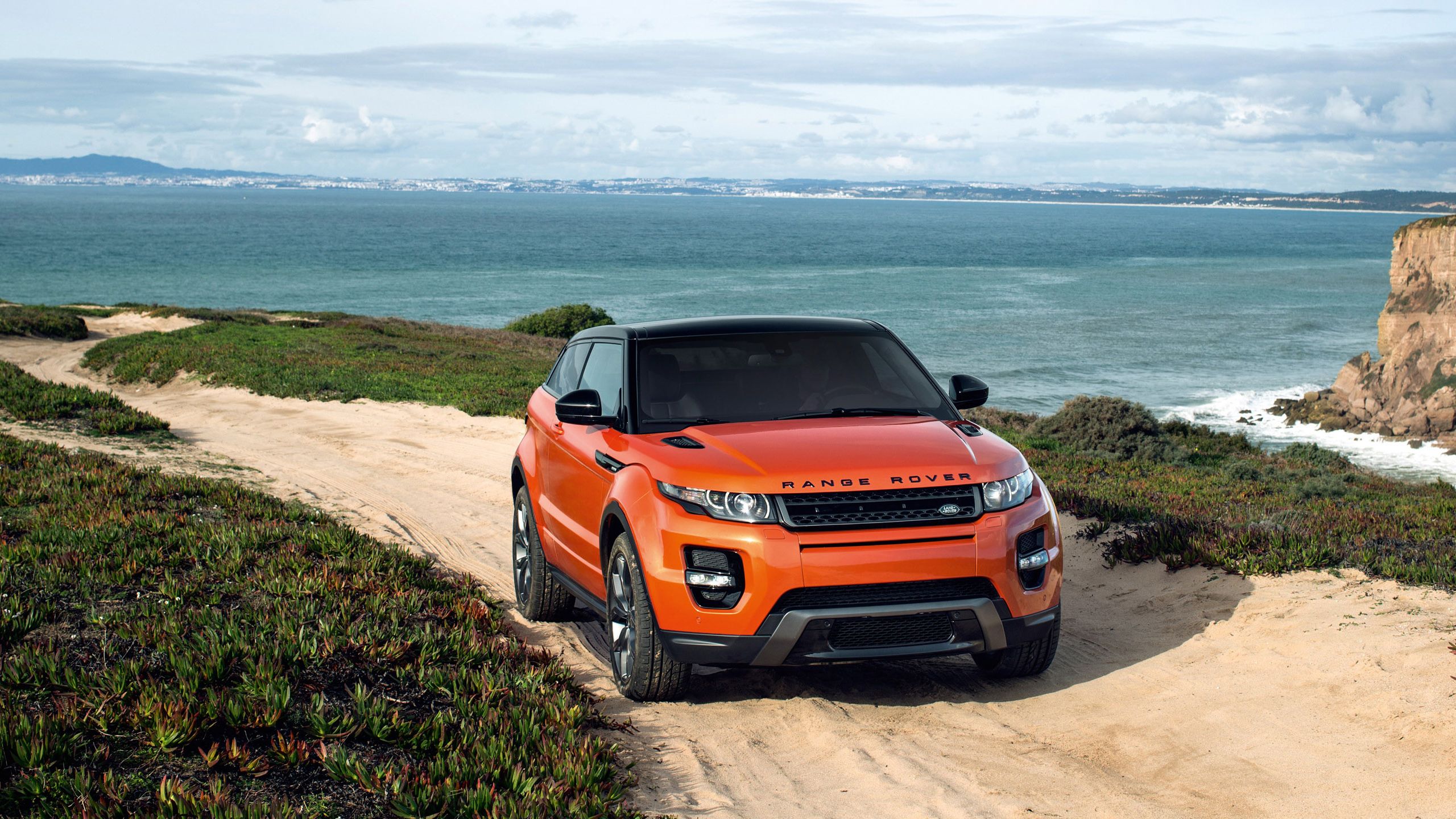 2560x1440 Orange Range Rover Wallpaper