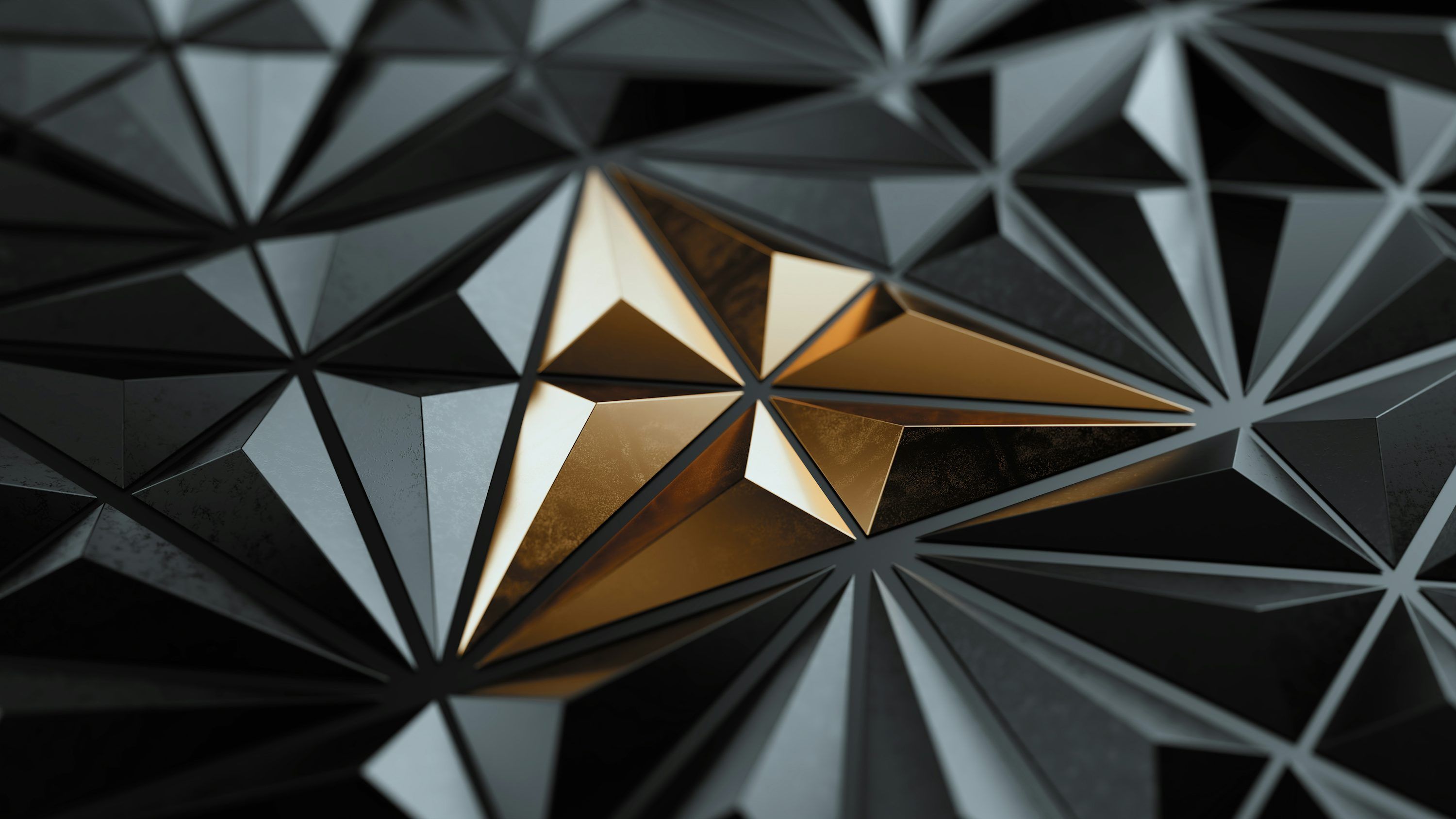 3000x1688 Geometric gold starburst on dark background