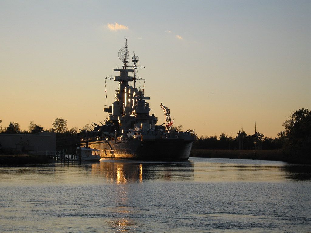 1024x768 Battleship at Sunset. The USS North Carolina at sunset