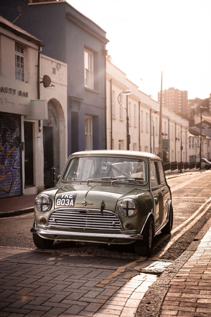 736x1104 Classic Mini Cooper. Mini cooper cafe racer, Mini cooper parked in urban setting, Classic mini