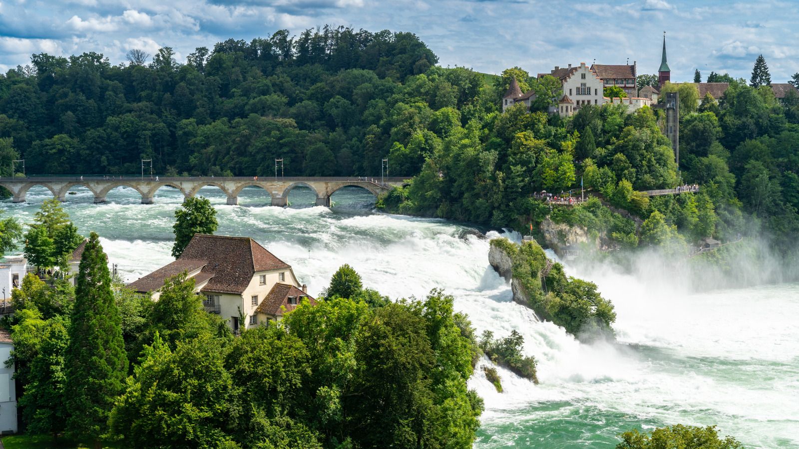 1600x900 Europe's Largest, Most Powerful Waterfall Boasts Unmatched Beauty Year Round In Switzerland