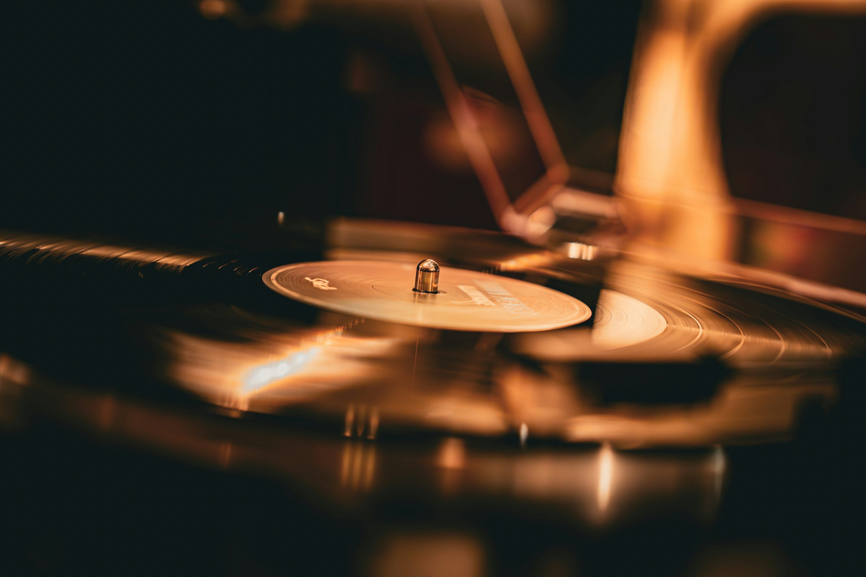 3000x2000 A vinyl record spins on the turntable