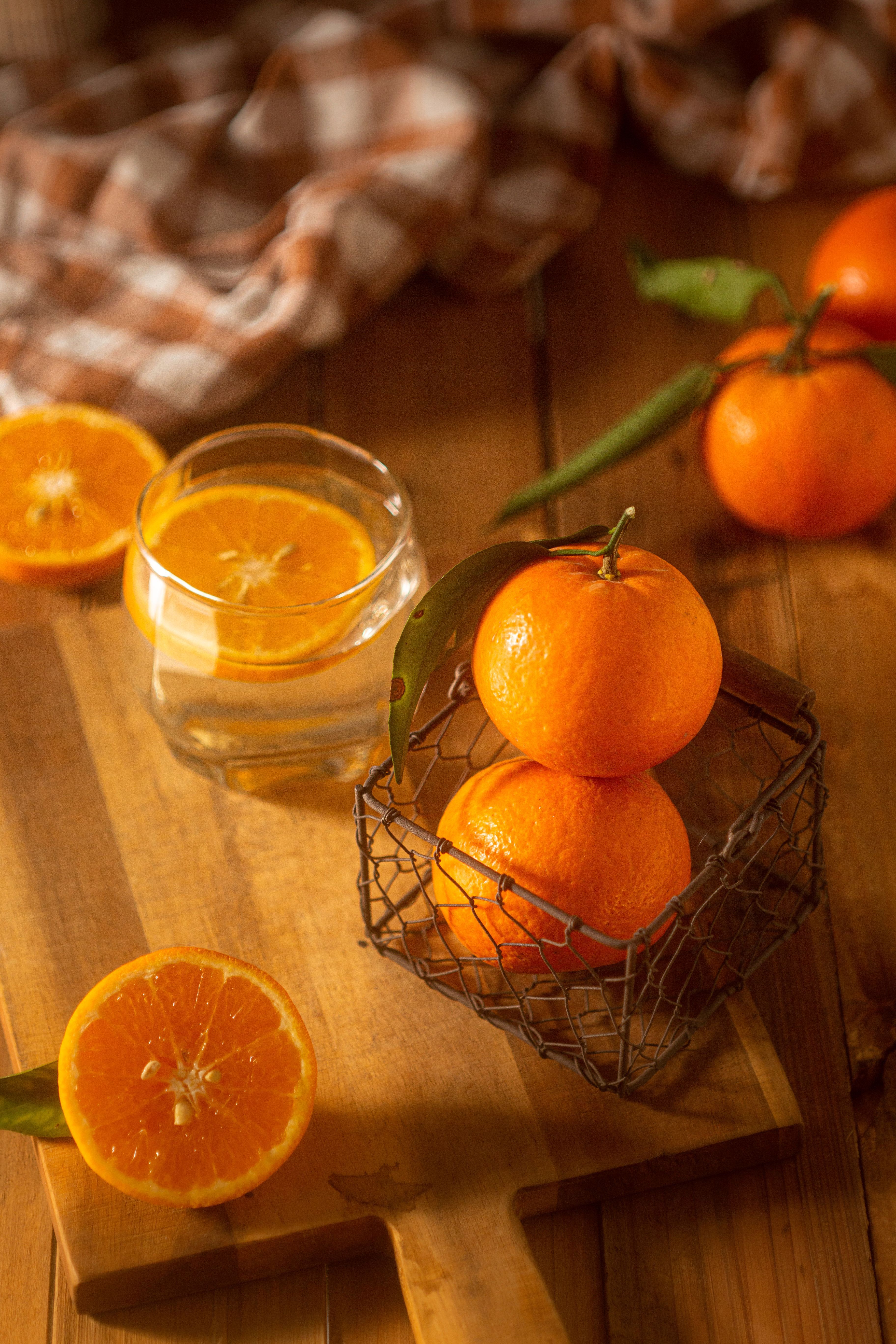 3648x5472 Glass of Water and Orange Fruits on Wooden Board · Free