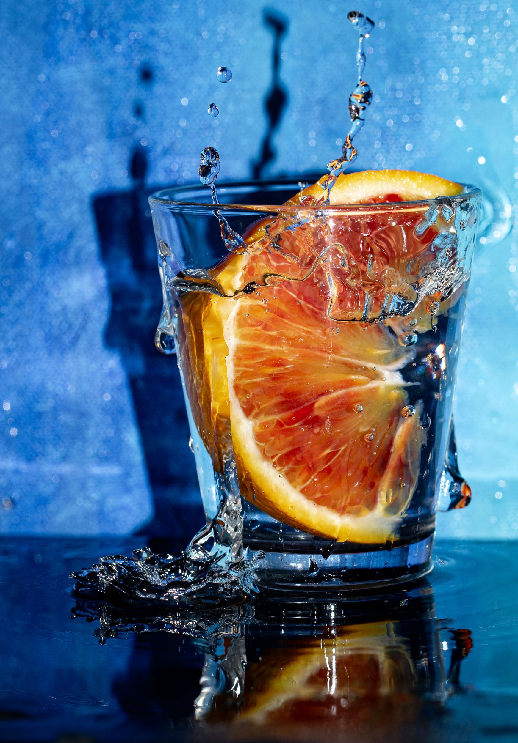 1741x2500 Refreshing Water with Vibrant Orange Slice Splash · Free