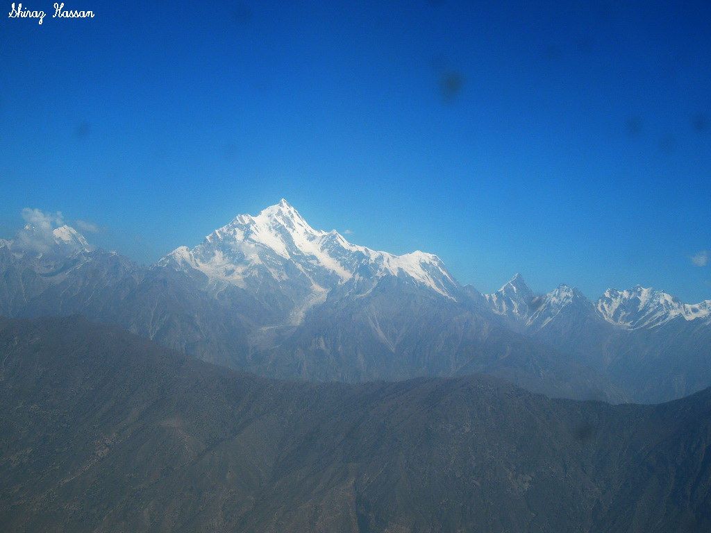 1024x768 Rakaposhi. Rakaposhi (Räkapoşi) (Urdu: راکا پہشئ), is a mou