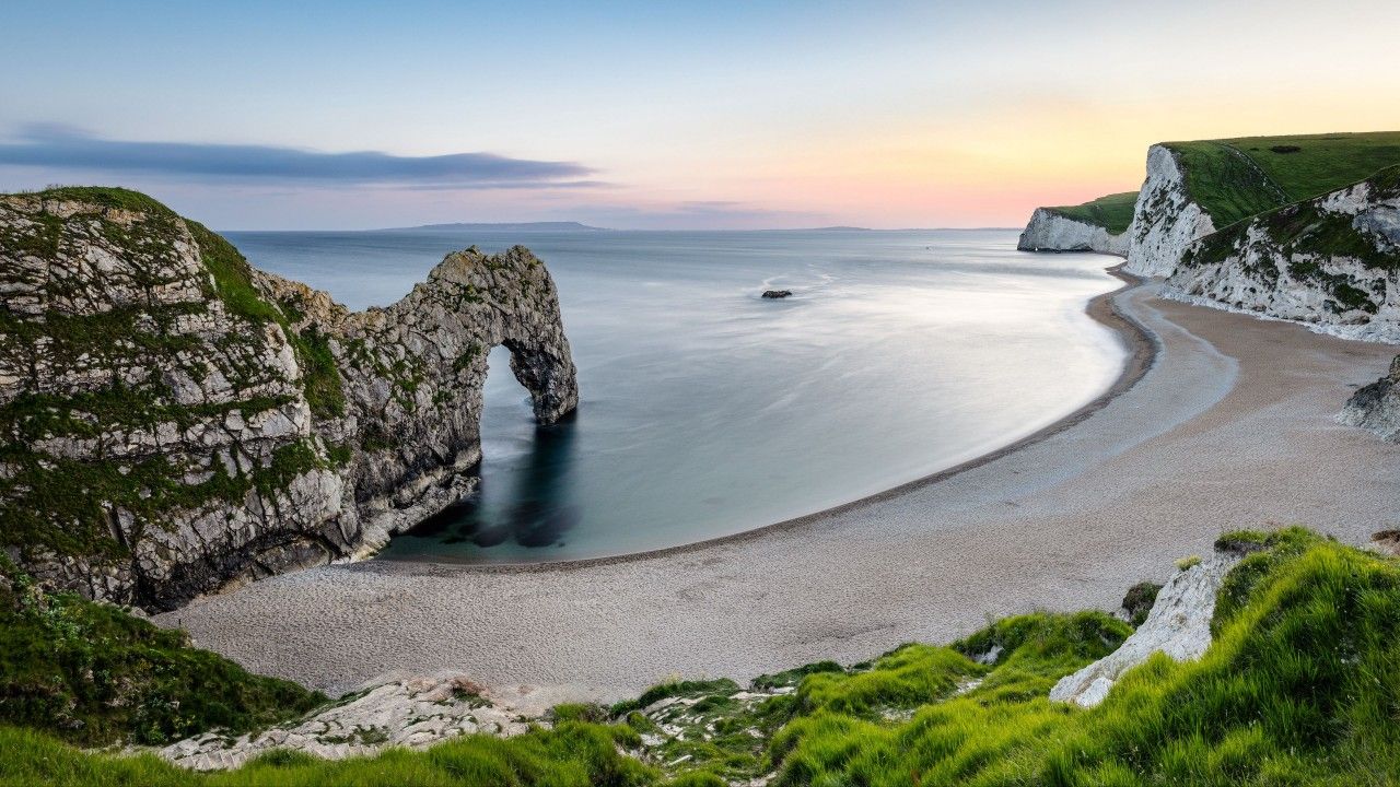 1280x720 Clouds Blue Sky View Background Beach Shore Rock Arch Beach Sand Stones 4K HD Nature Wallpaper