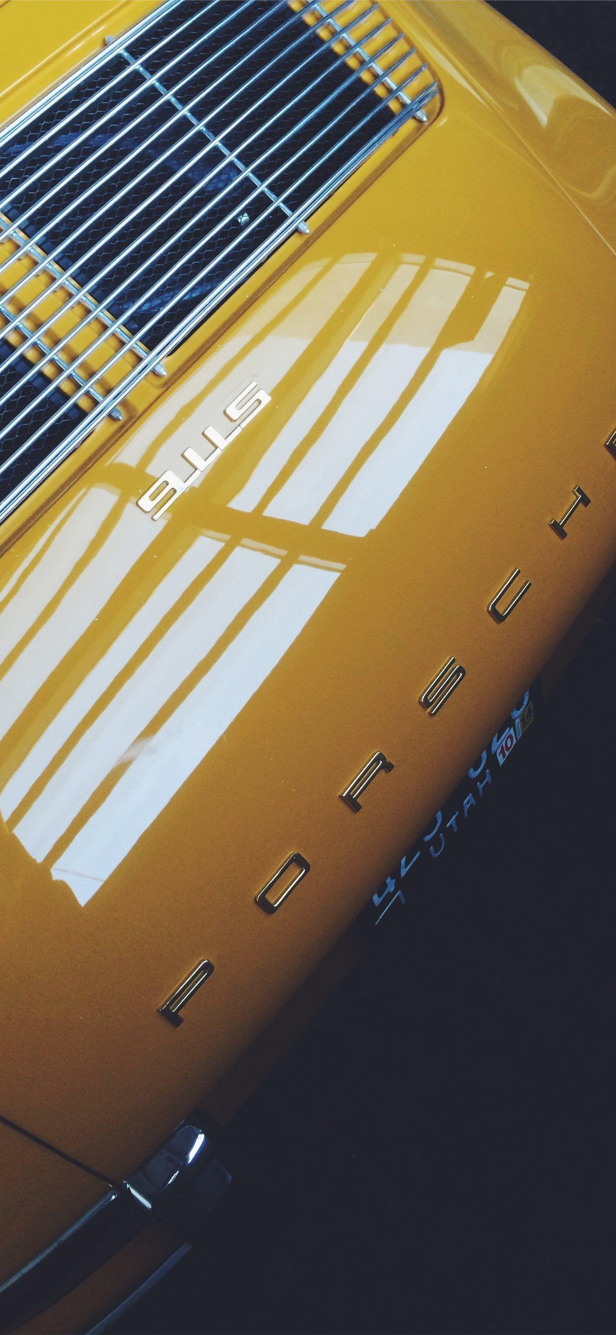 1242x2688 yellow and black Porsche vehicle iPhone X Wallpaper Free Download