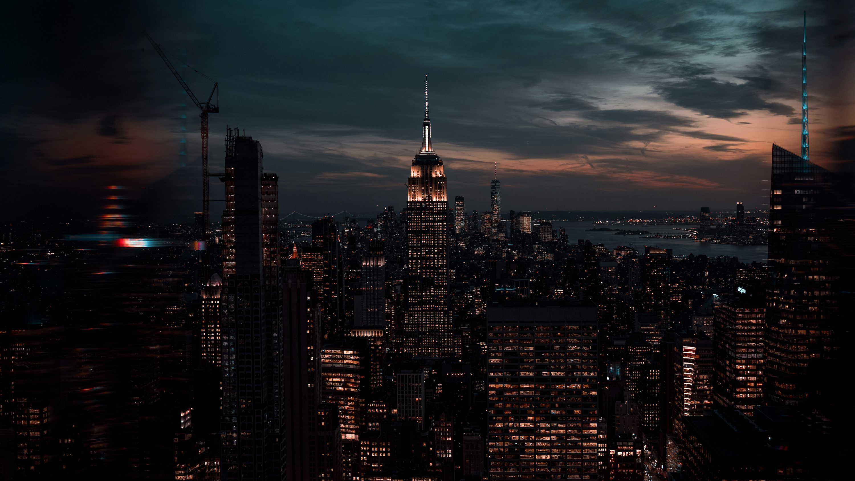 3000x1688 A view of a city at night from the top of a building
