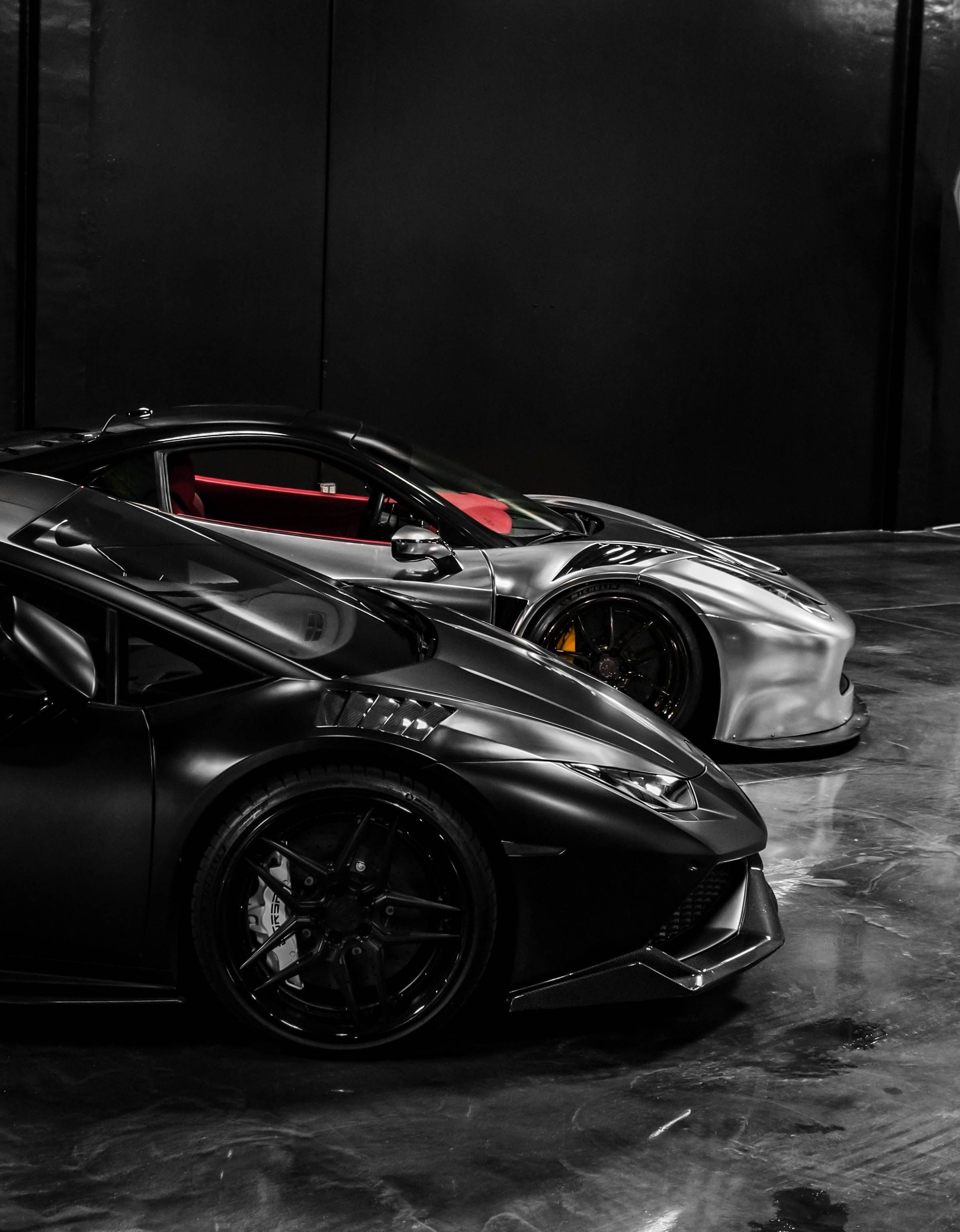 2395x3073 A black and white photo of two sports cars · Free