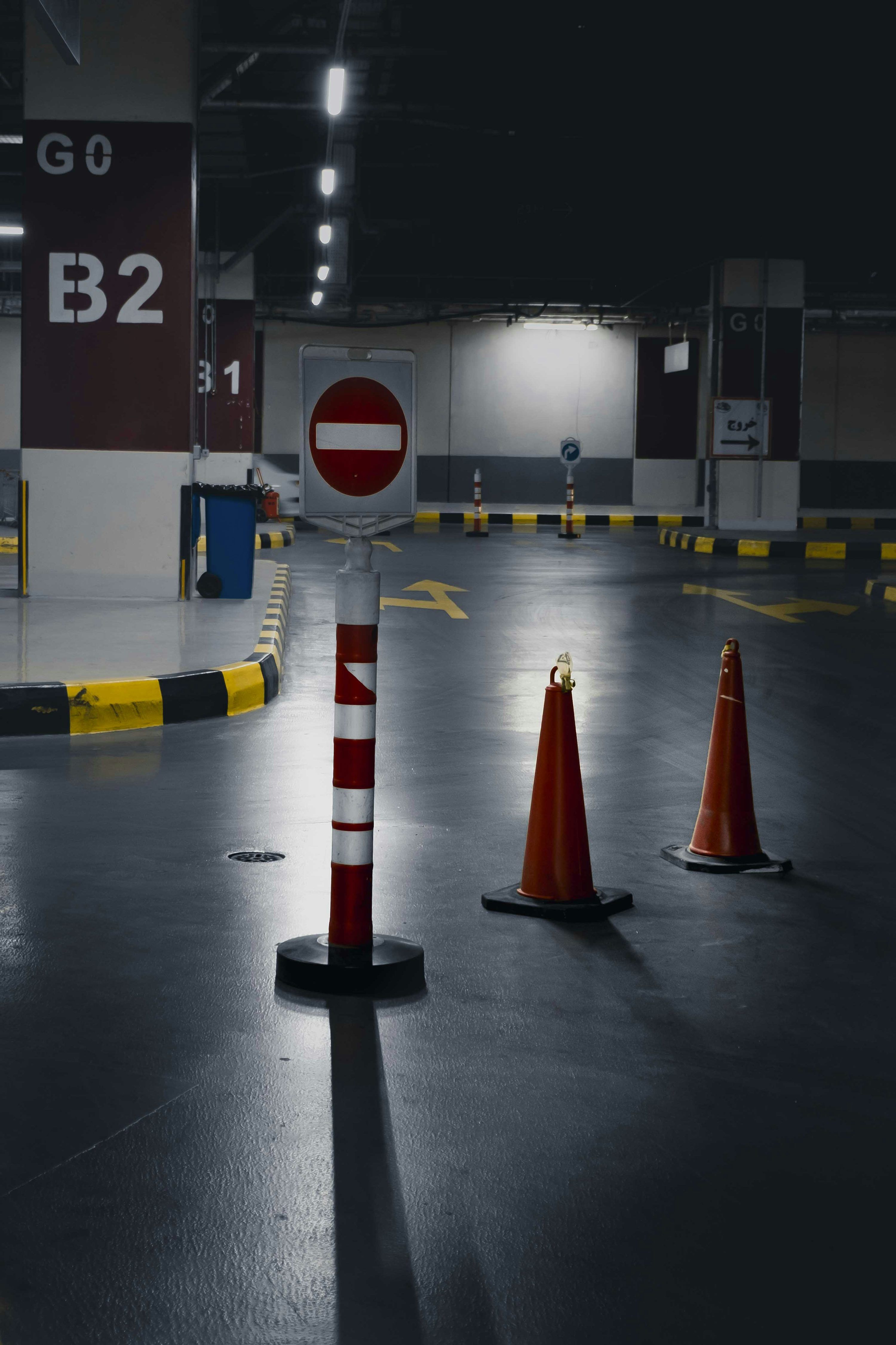 3000x4500 A parking garage filled with lots of traffic cones
