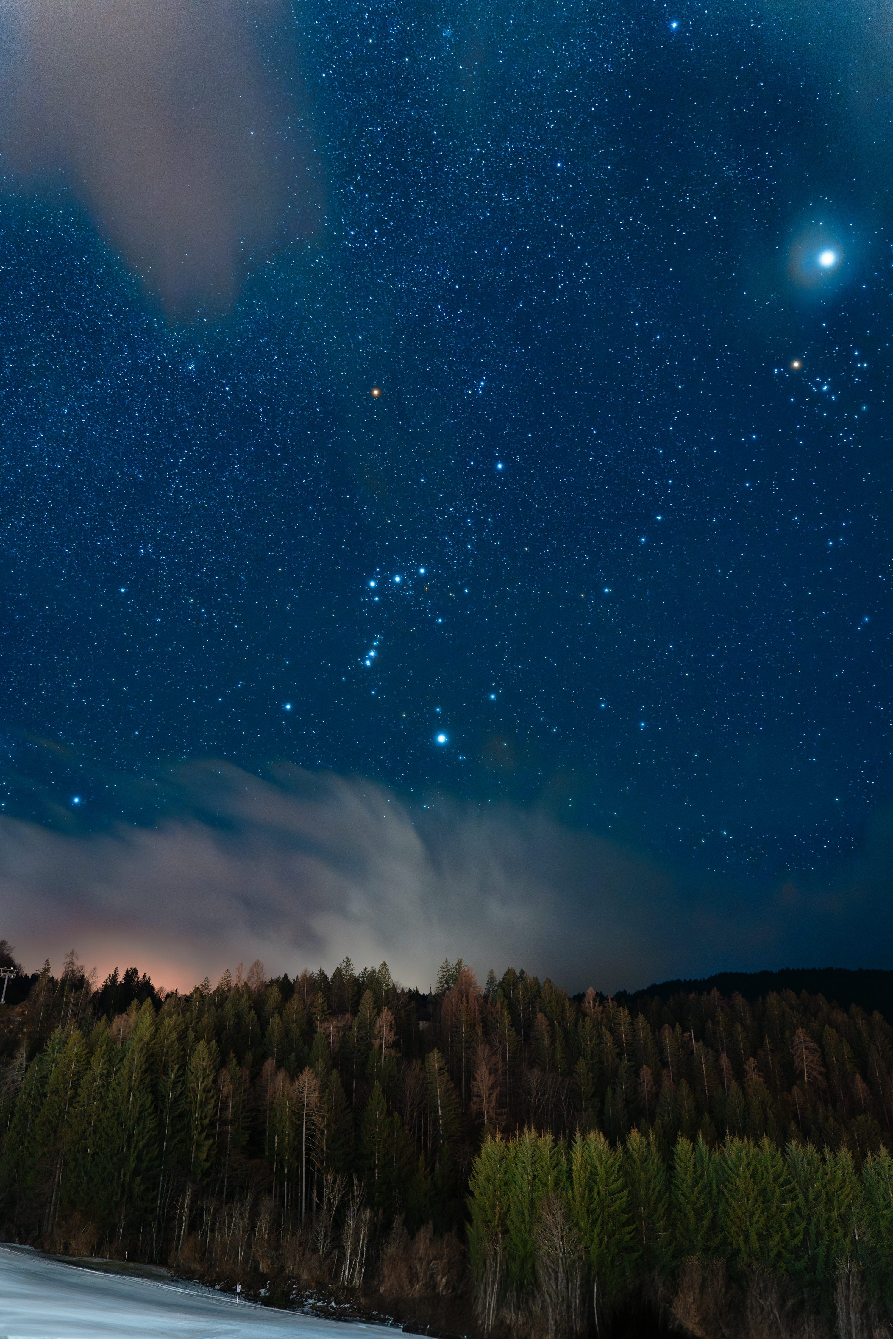 3000x4498 The night sky is filled with stars and clouds