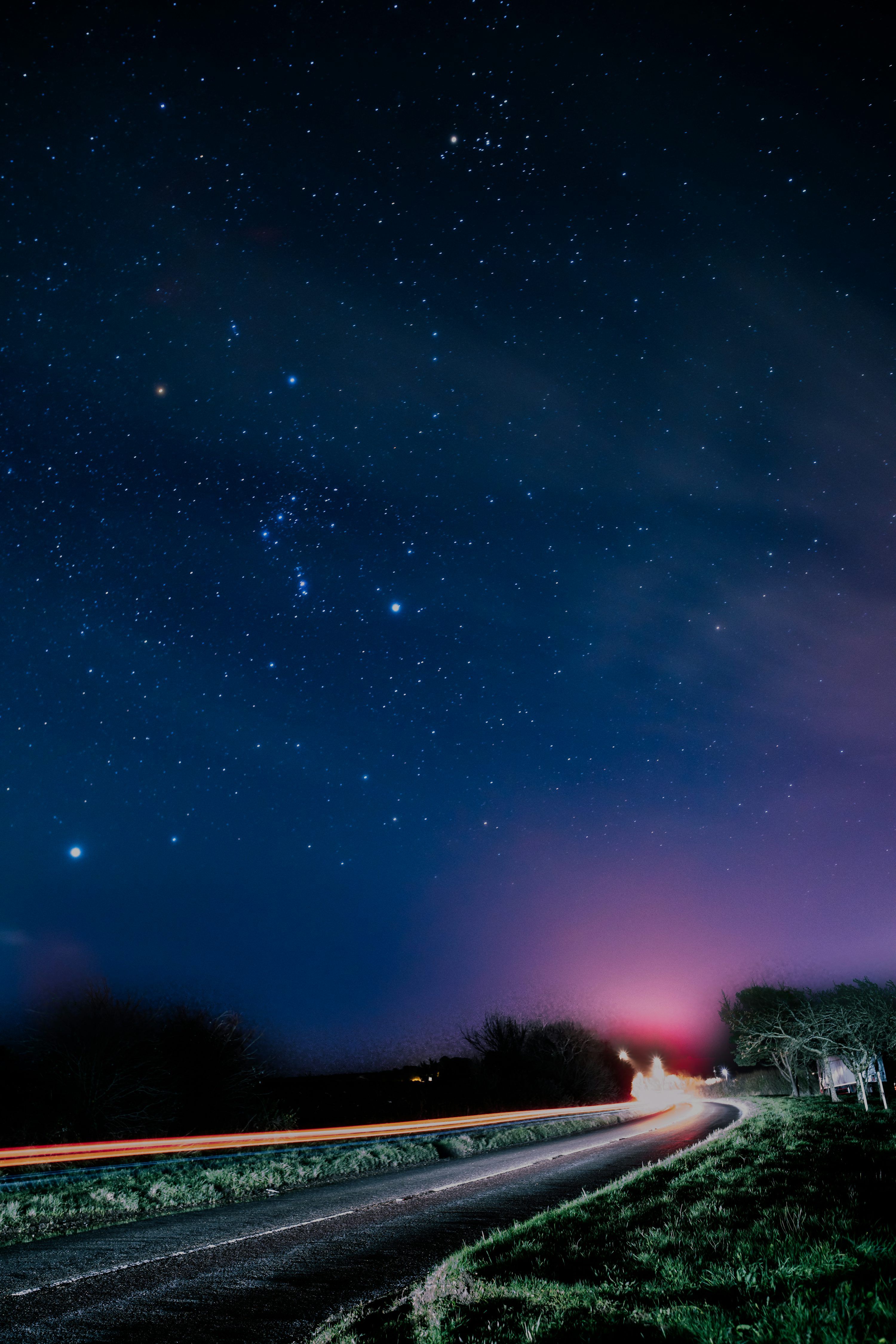 3000x4500 A starry night sky over a winding road